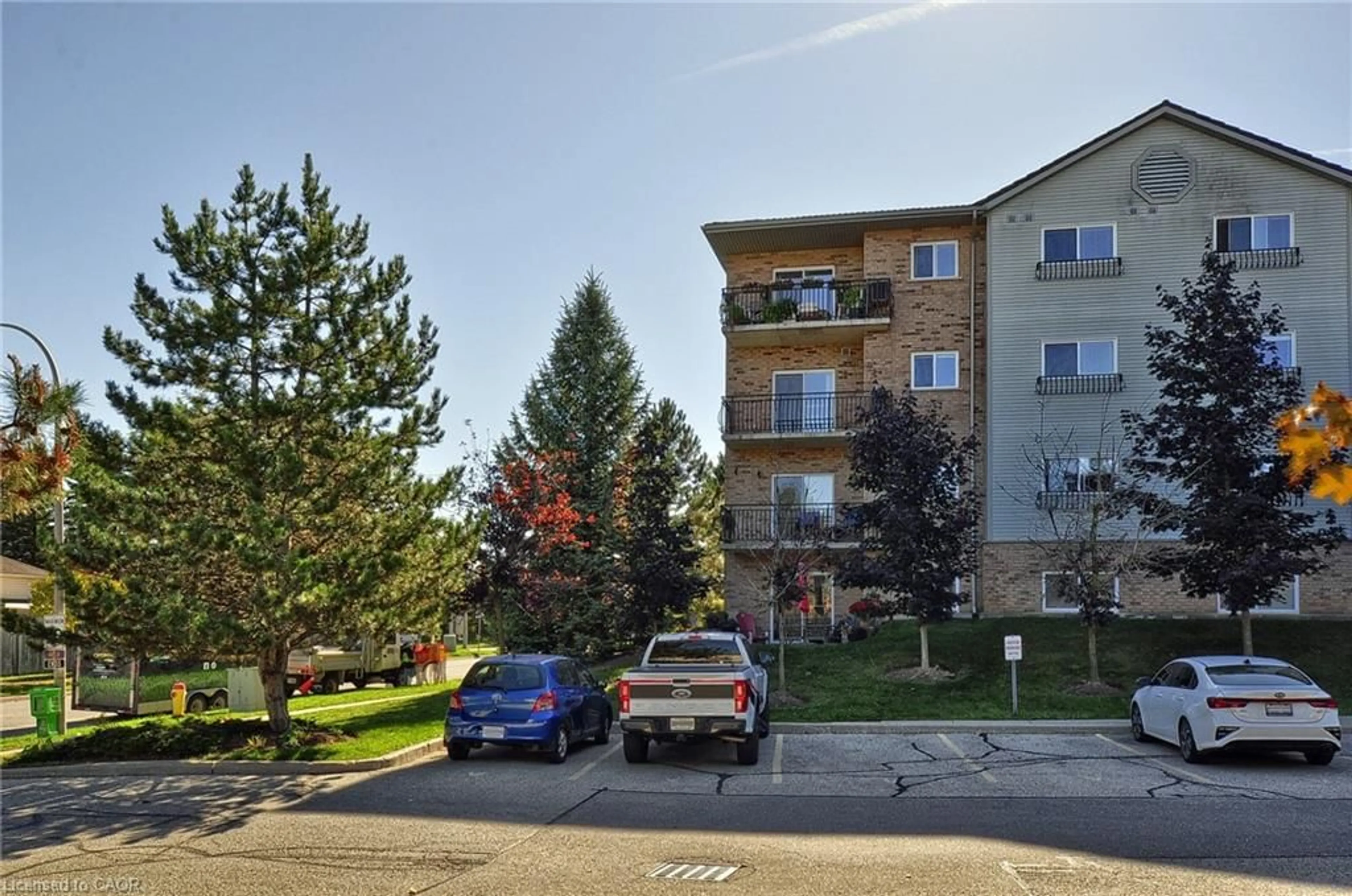 A pic from outside/outdoor area/front of a property/back of a property/a pic from drone, street for 345 Briarmeadow Dr #302, Kitchener Ontario N2A 4J6