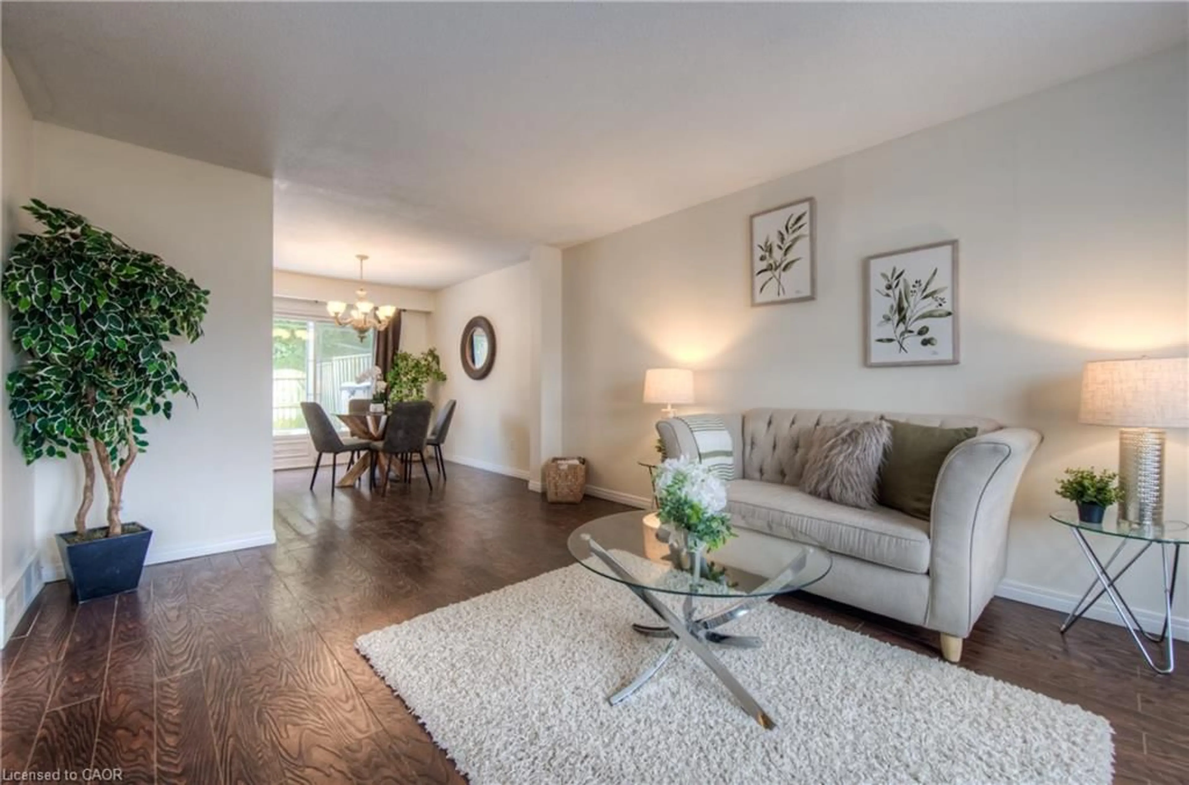 Living room with furniture, wood/laminate floor for 206 Green Valley Dr #7, Kitchener Ontario N2P 1G9