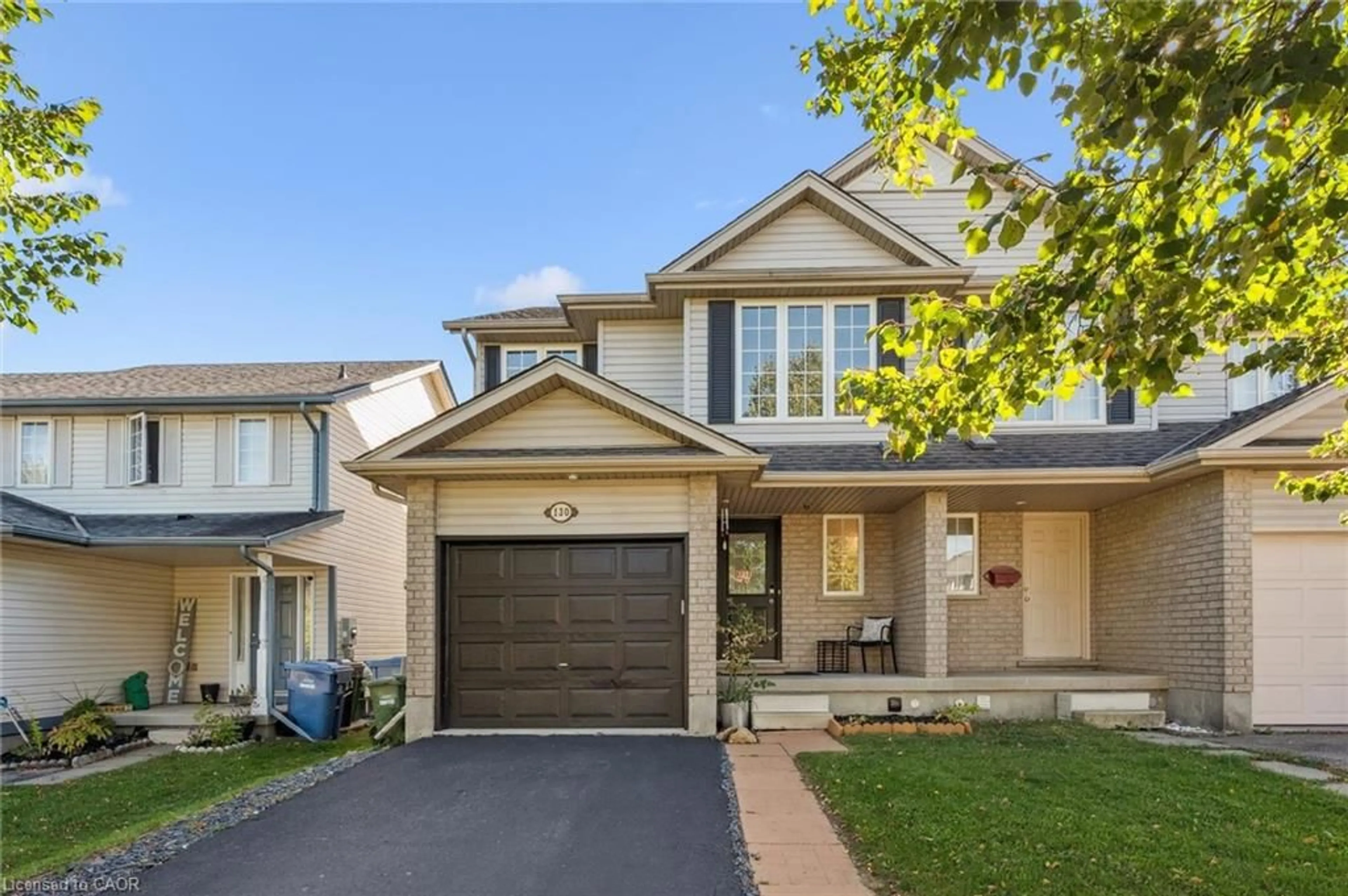 Home with vinyl exterior material, street for 130 Silurian Dr, Guelph Ontario N1E 7G1