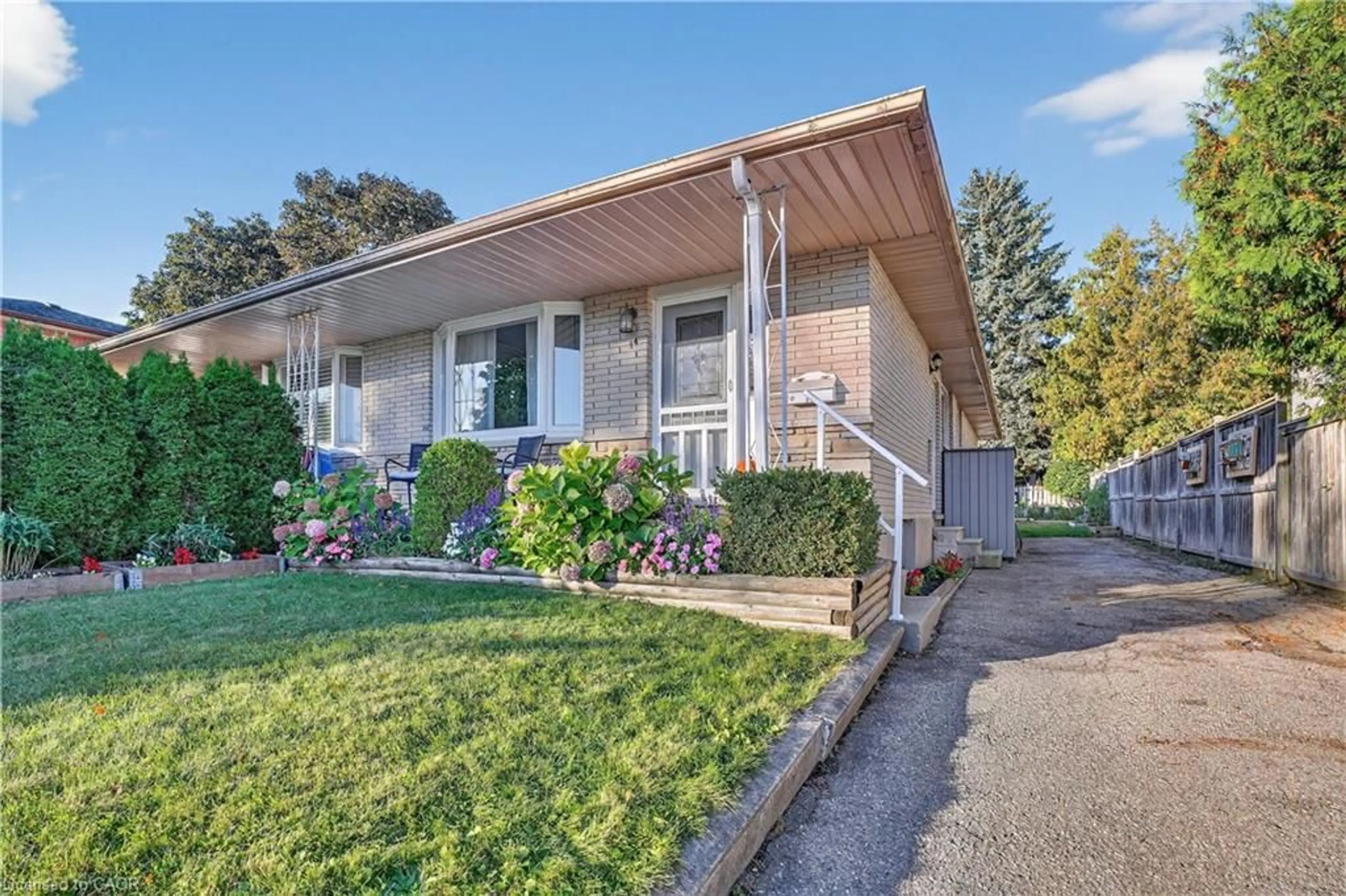 Home with vinyl exterior material, street for 14 Carnaby Cres, Kitchener Ontario N2A 1M7