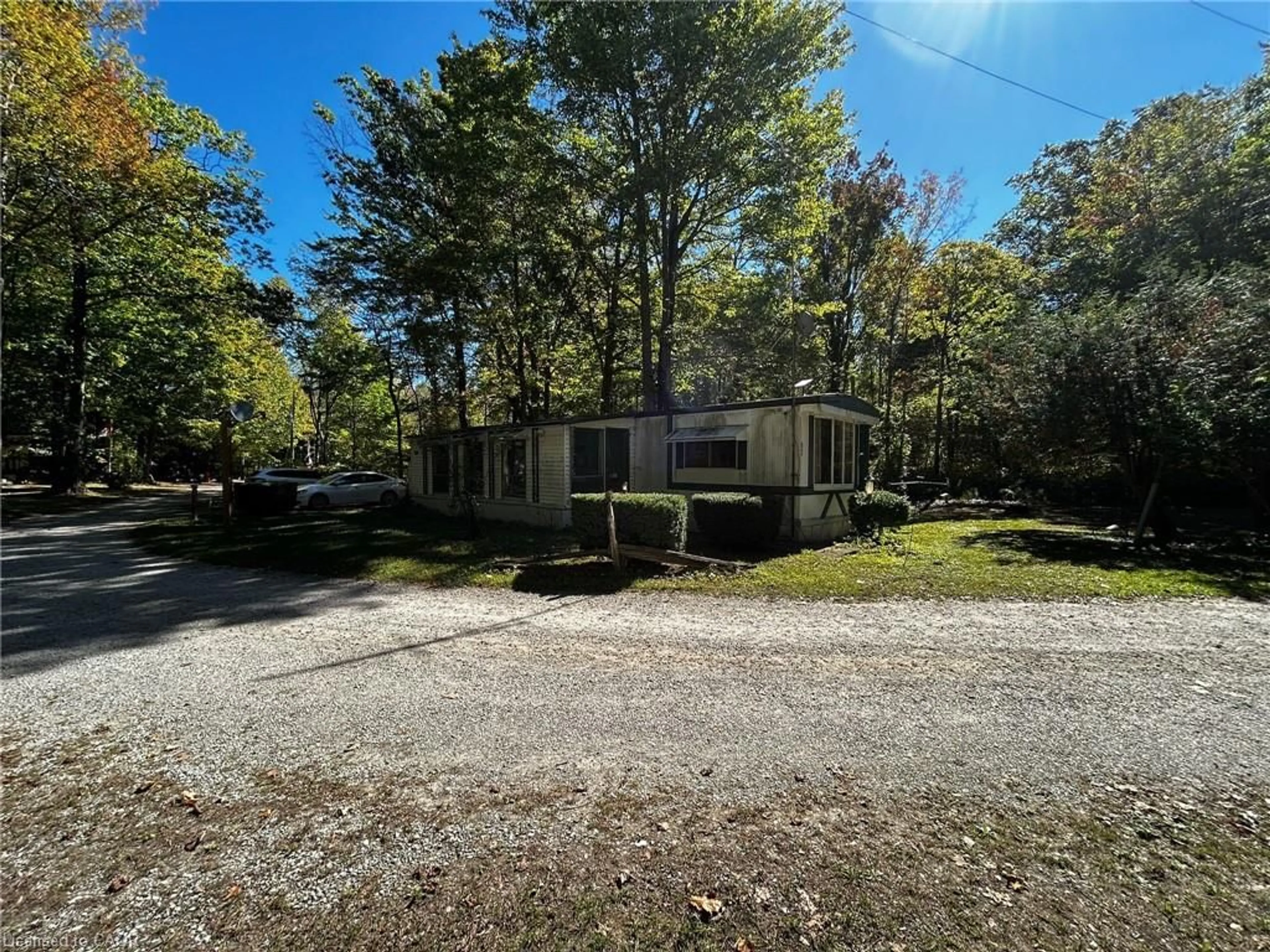 A pic from outside/outdoor area/front of a property/back of a property/a pic from drone, street for 334 Rattlesnake Rd #62, Lowbanks Ontario N0A 1K0