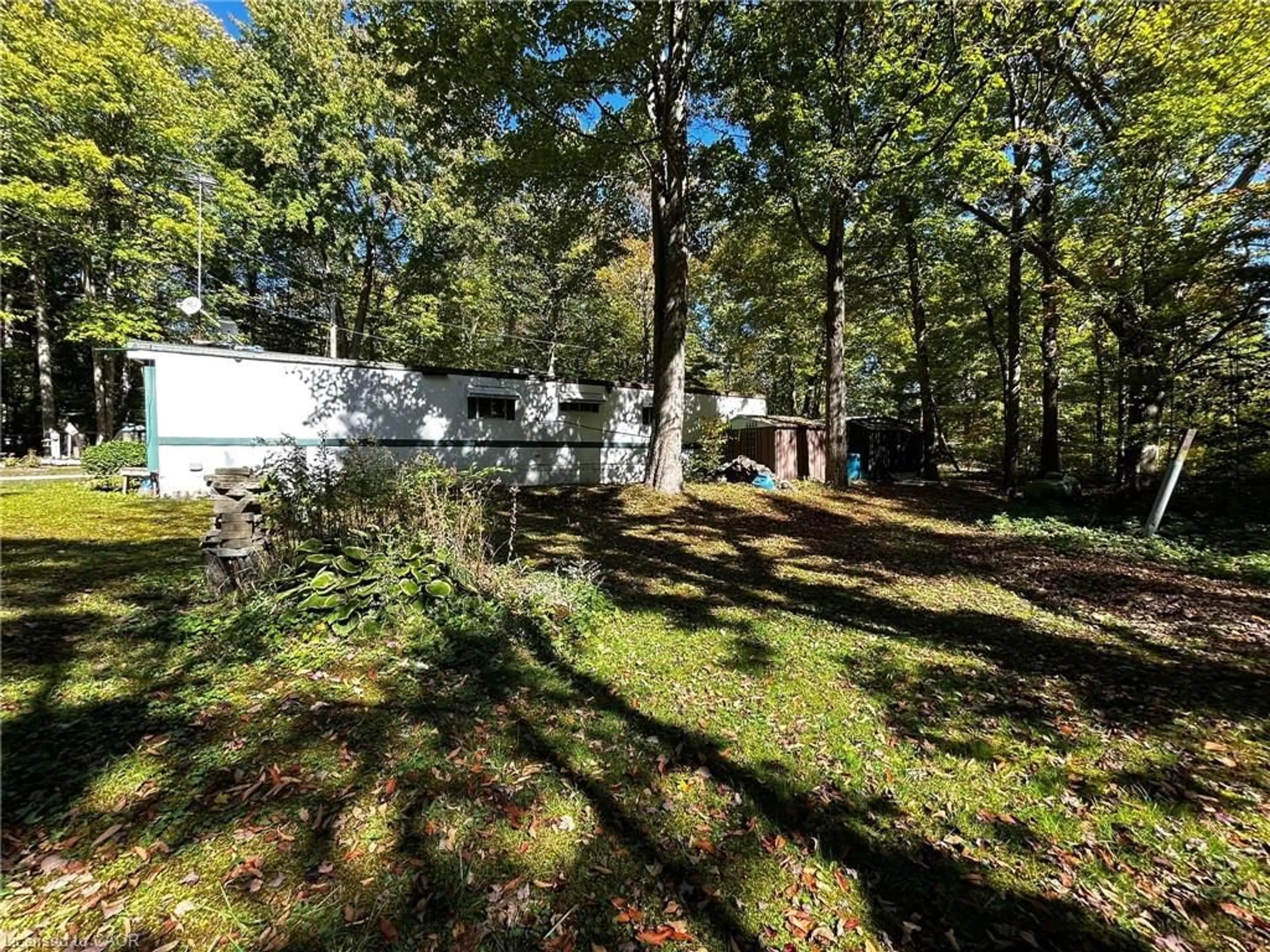 A pic from outside/outdoor area/front of a property/back of a property/a pic from drone, forest/trees view for 334 Rattlesnake Rd #62, Lowbanks Ontario N0A 1K0