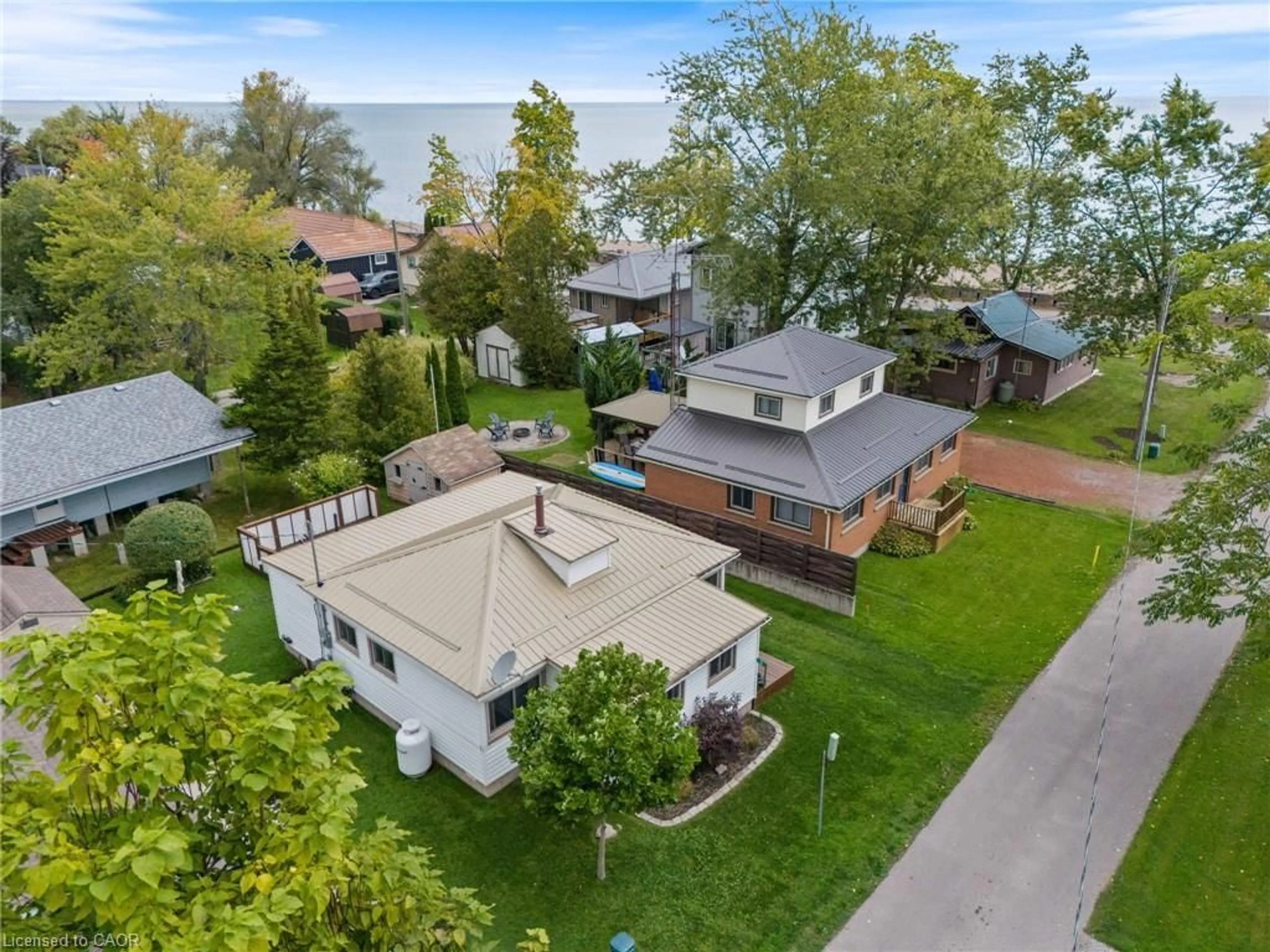 A pic from outside/outdoor area/front of a property/back of a property/a pic from drone, street for 3 Harold St, Turkey Point Ontario N0E 1T0