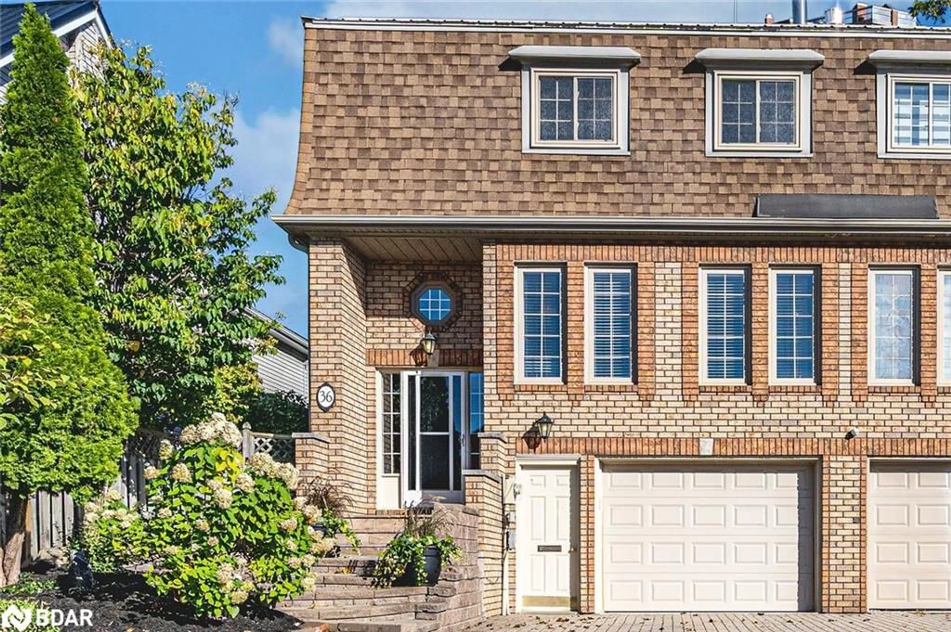 Home with brick exterior material, street for 36 Kempenfelt Dr, Barrie Ontario L4M 1B9