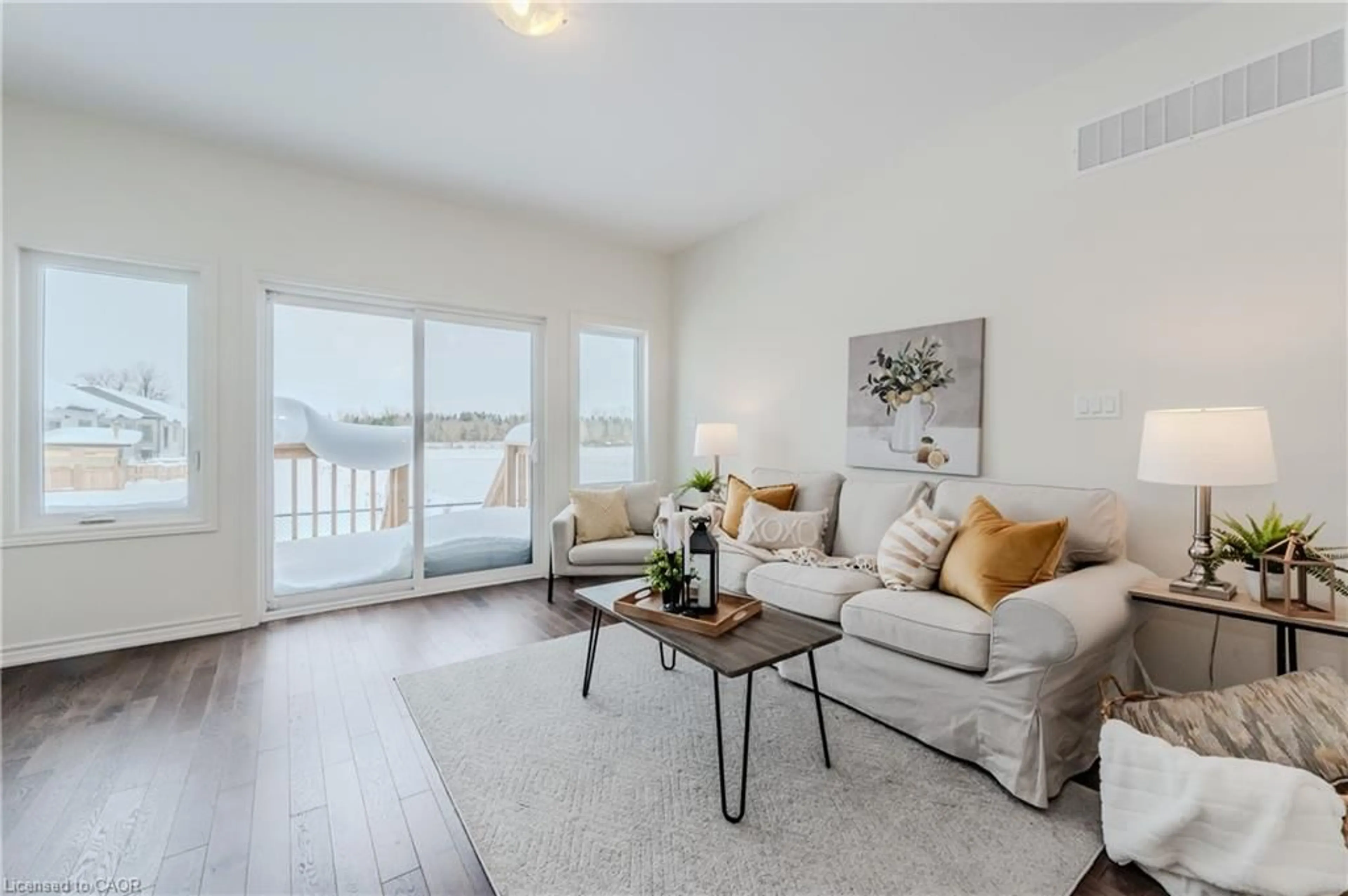 Living room with furniture, wood/laminate floor for 104 Cheryl Ave, Atwood Ontario N0G 1B0