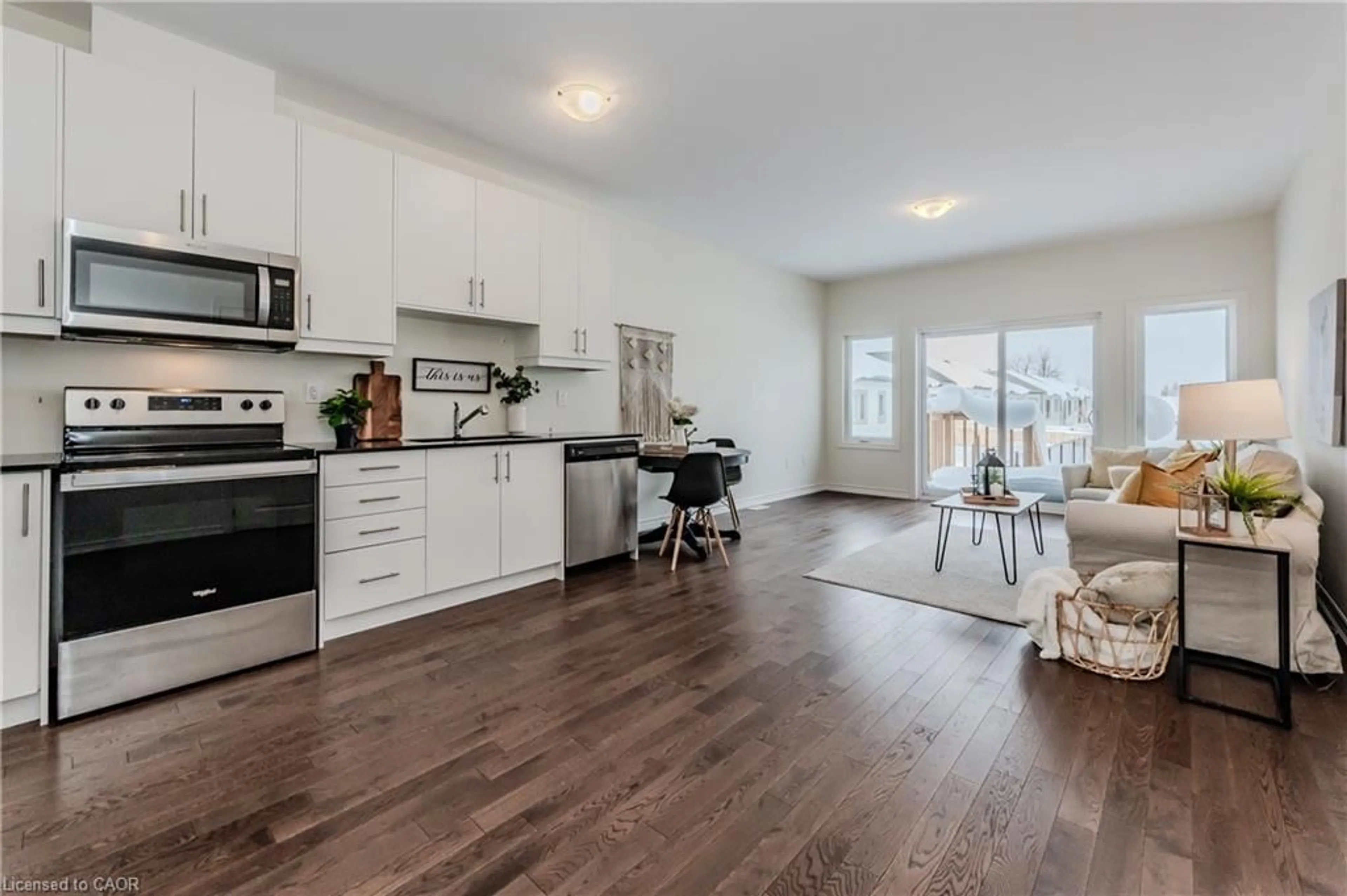 Open concept kitchen, wood/laminate floor for 104 Cheryl Ave, Atwood Ontario N0G 1B0