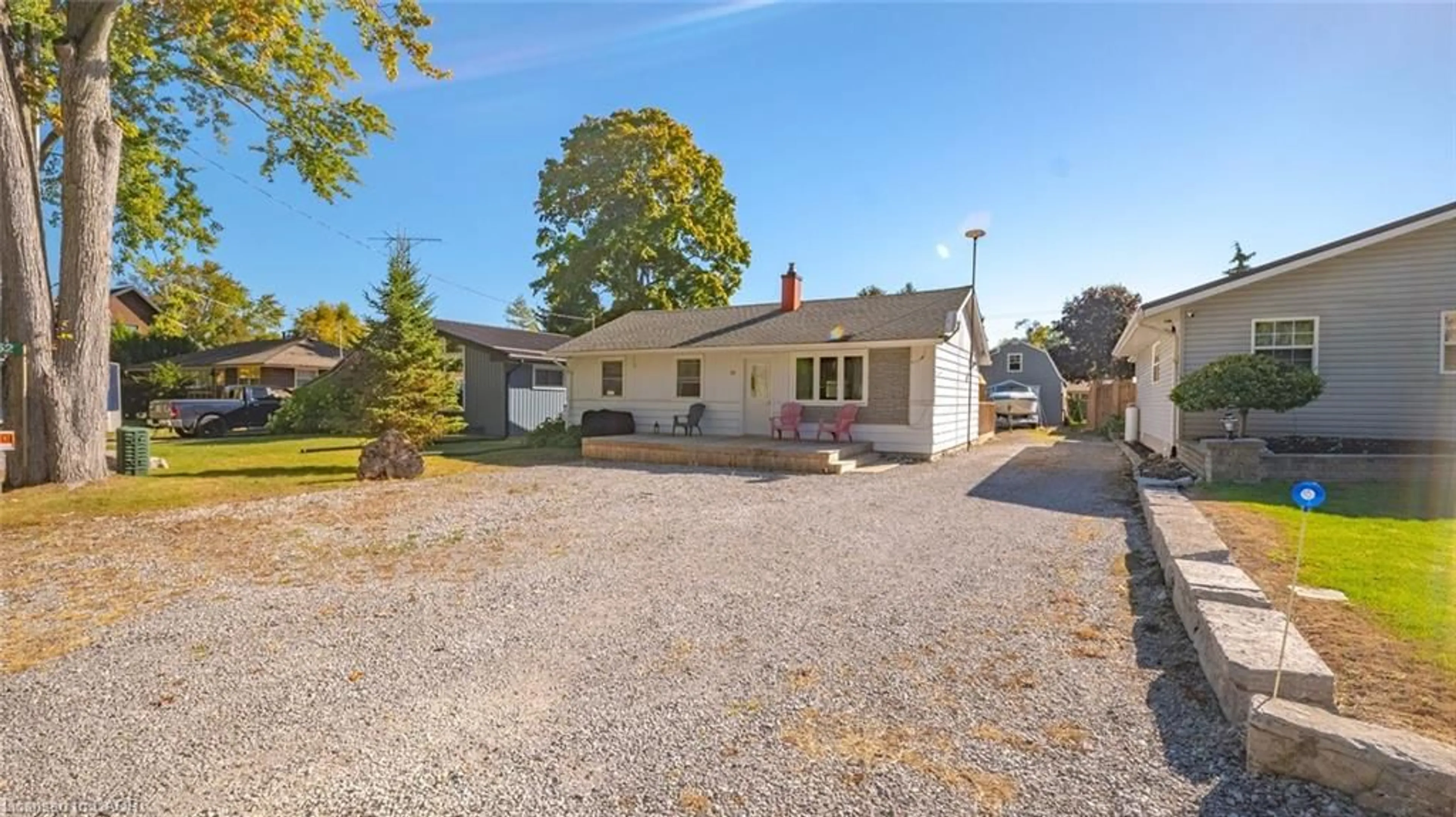 A pic from outside/outdoor area/front of a property/back of a property/a pic from drone, street for 52 Ridgewood Dr, Turkey Point Ontario N0E 1W0