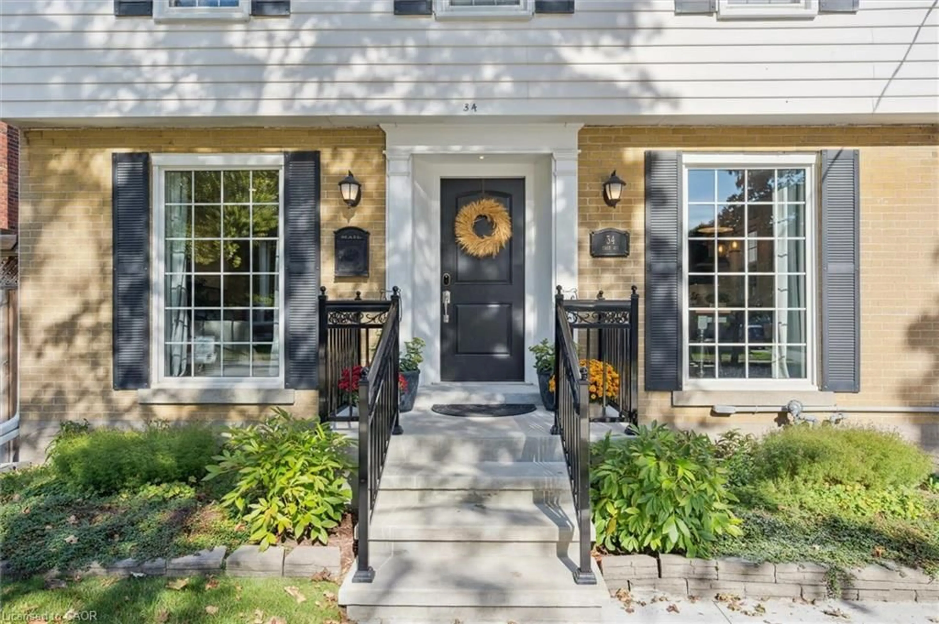 Home with brick exterior material, street for 34 East Ave, Kitchener Ontario N2H 1Y7