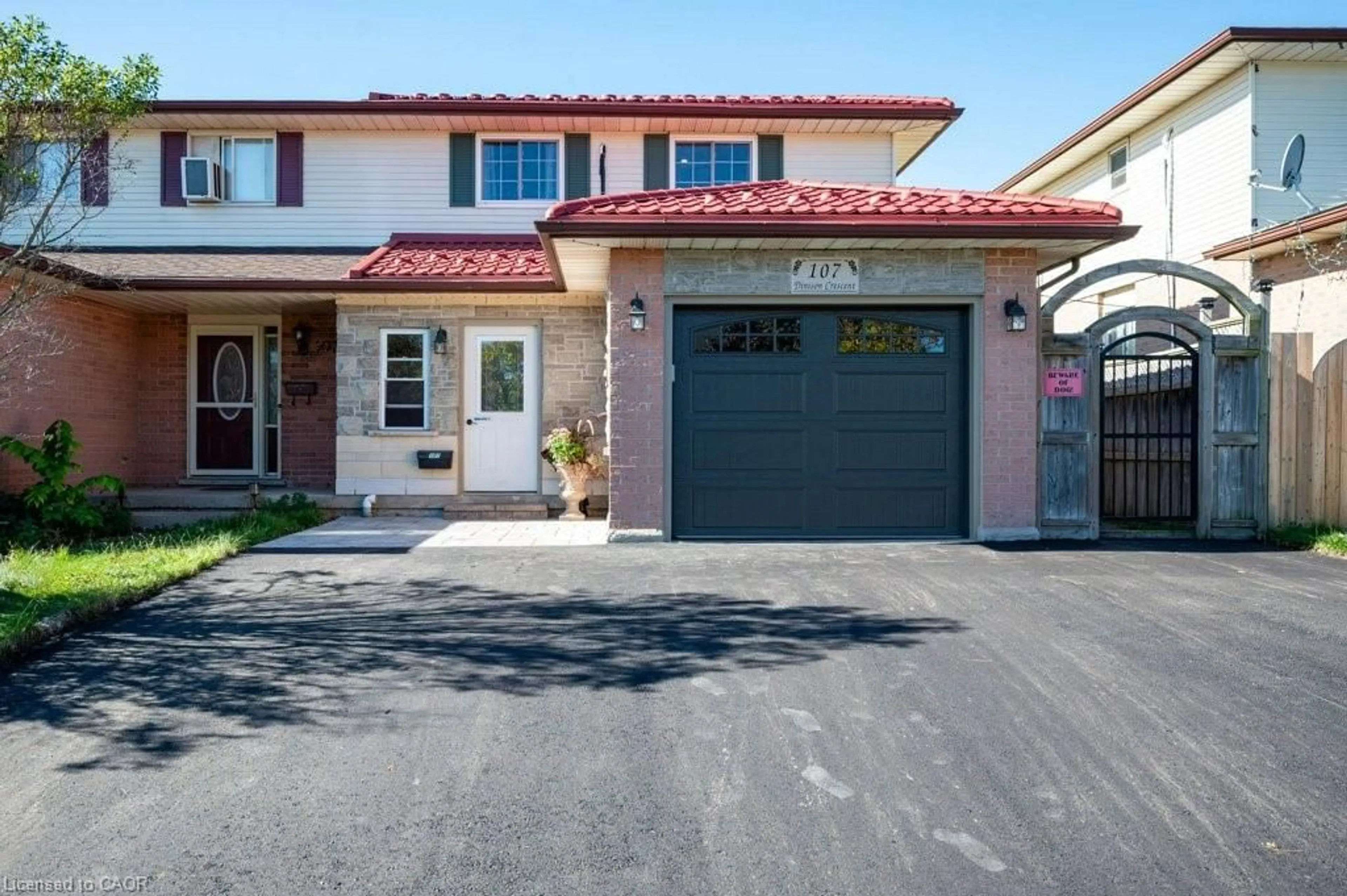 Home with brick exterior material, street for 107 Dinison Cres, Kitchener Ontario N2E 2S6