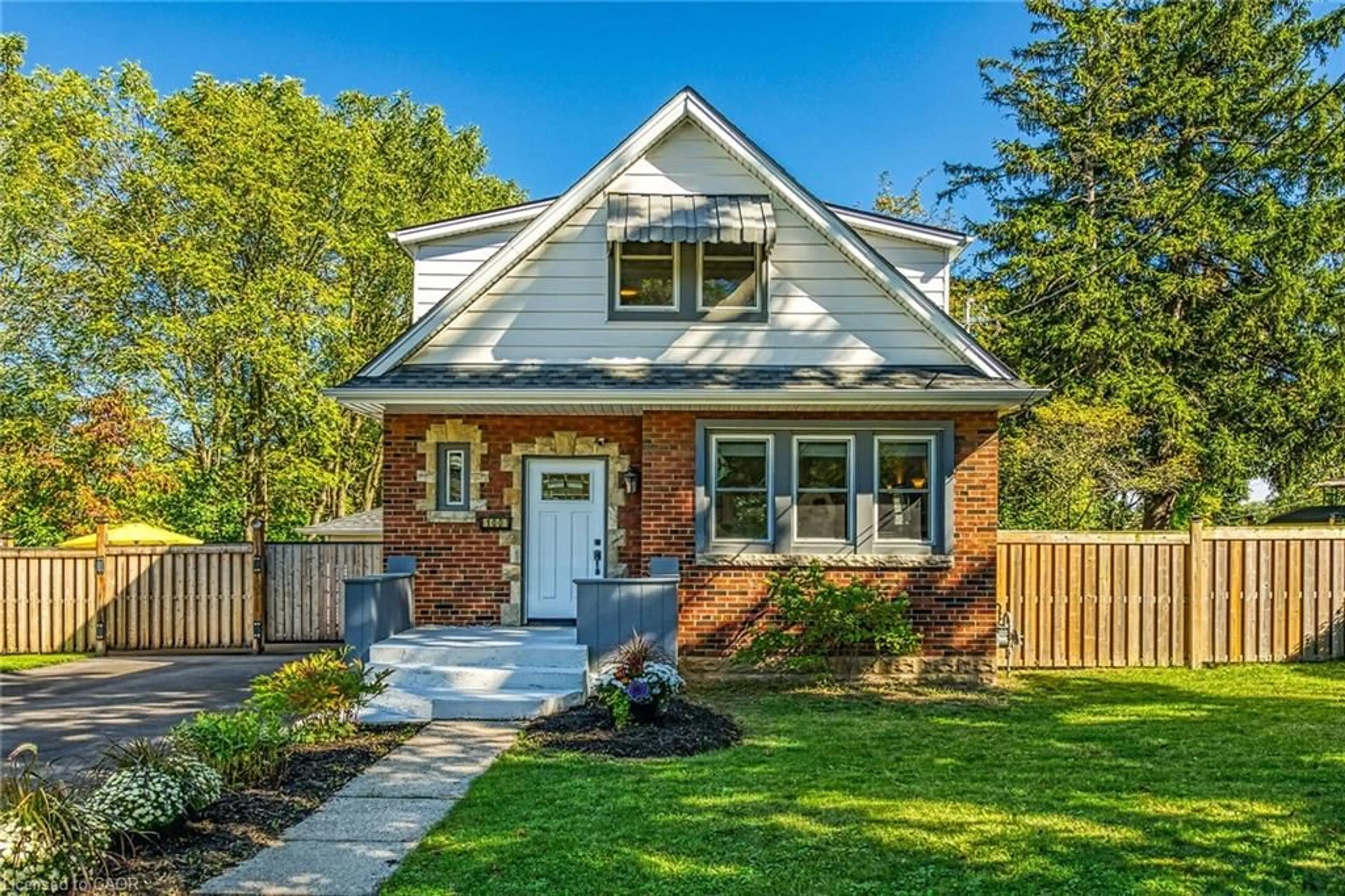 Home with brick exterior material, street for 100 Wigton St, Caledonia Ontario N3W 1E9