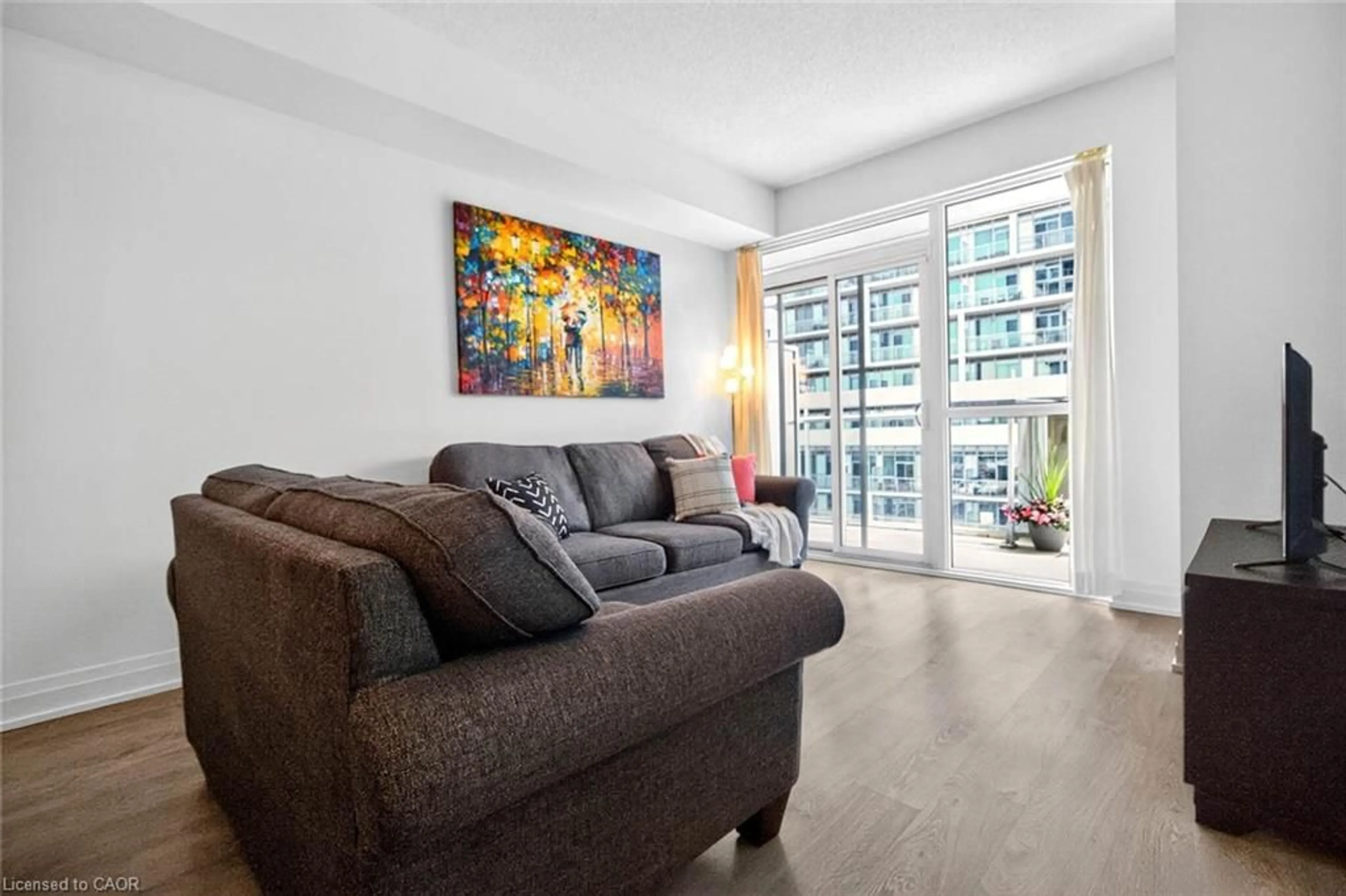 Living room with furniture, unknown for 65 Speers Rd #607, Oakville Ontario L6K 0J1