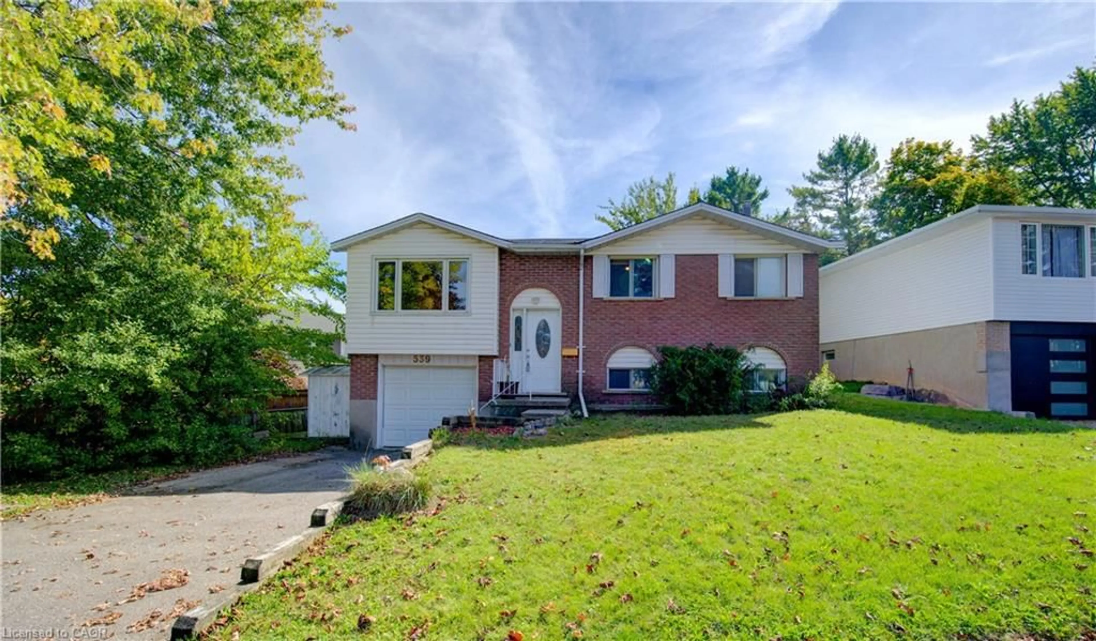 Home with vinyl exterior material, street for 539 Pioneer Dr, Kitchener Ontario N2P 1P3