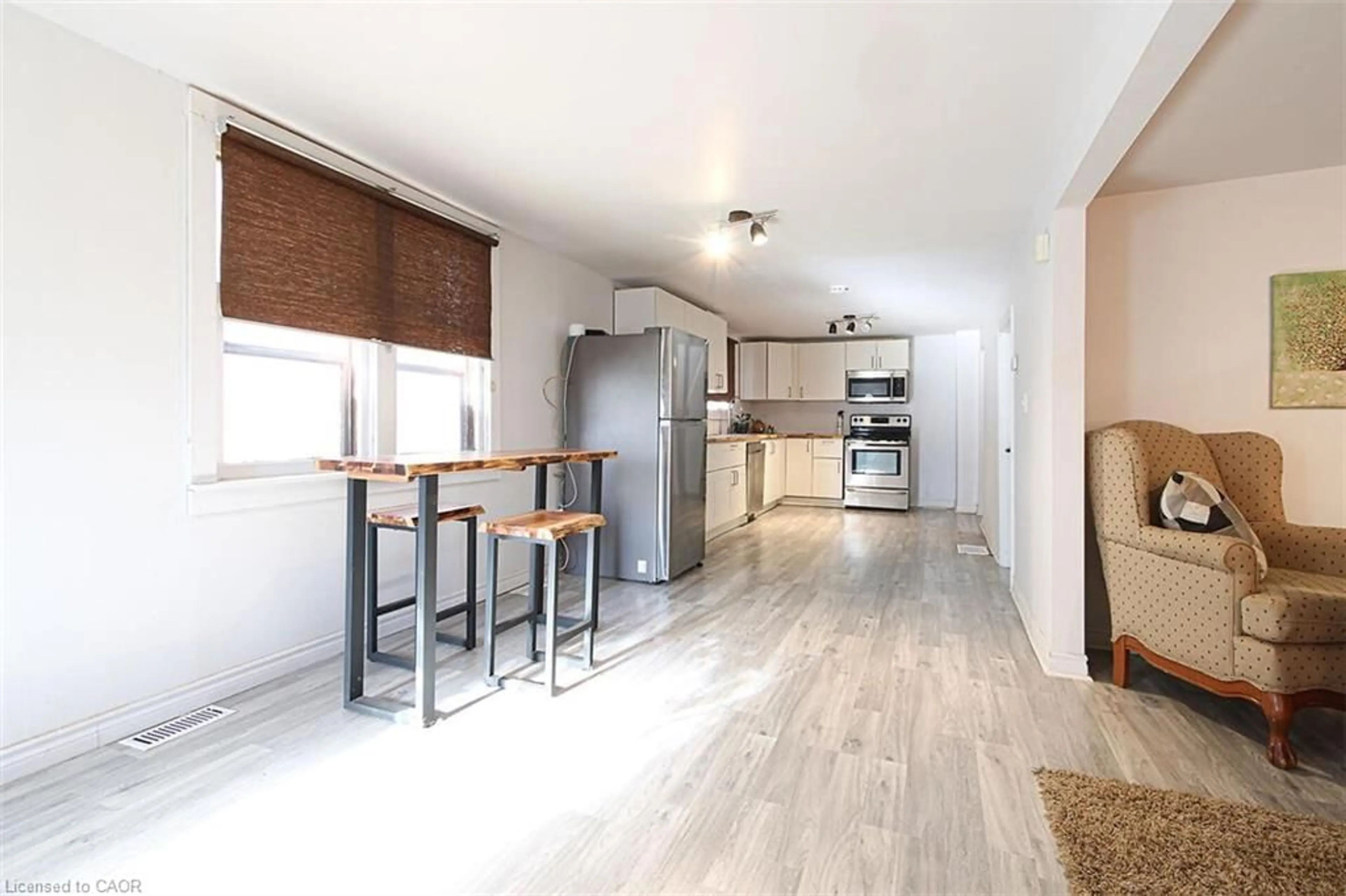 Open concept kitchen, wood/laminate floor for 727 Tate Ave, Hamilton Ontario L8H 6L8