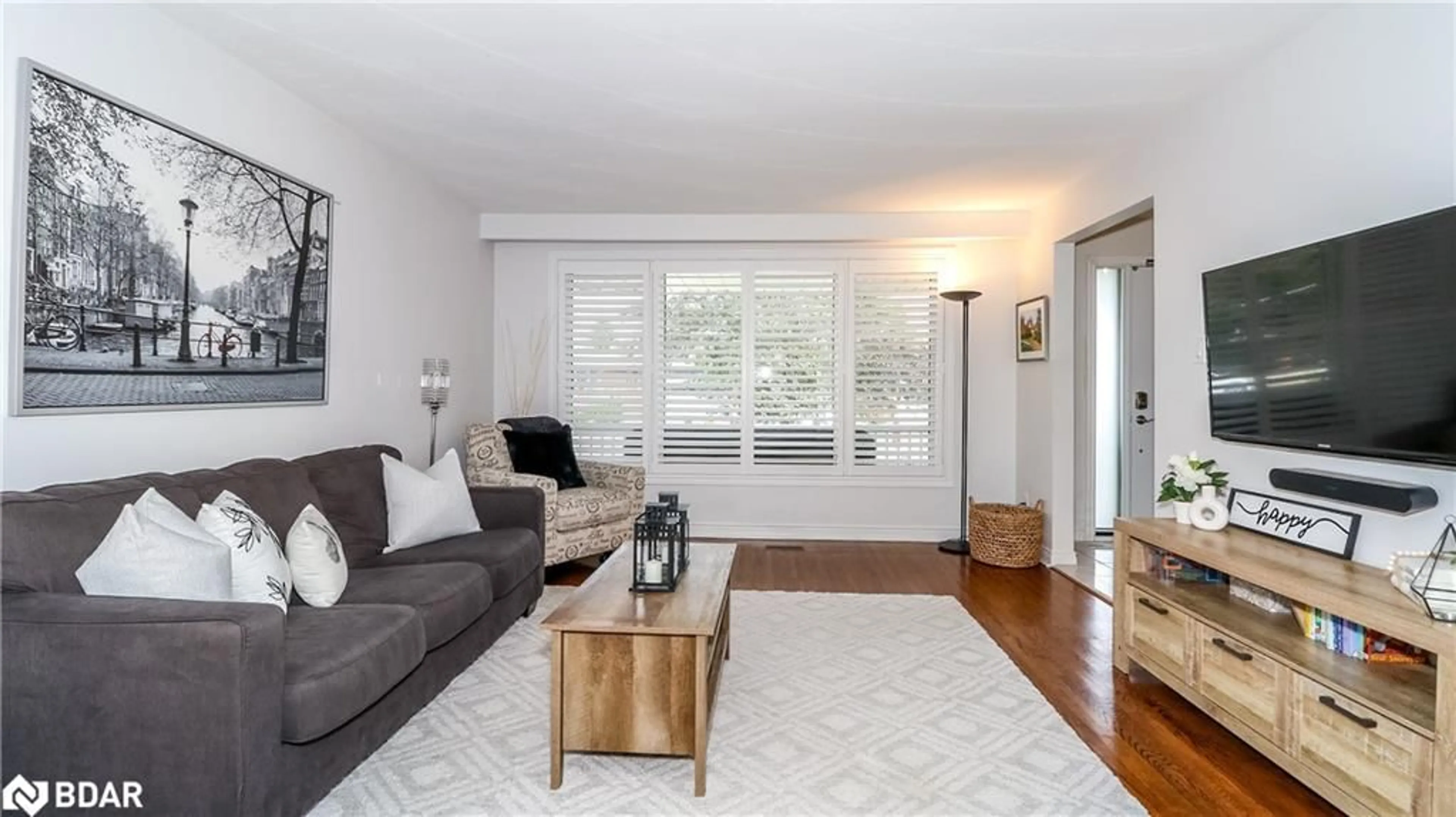 Living room with furniture, wood/laminate floor for 752 Silcote Rd, Mississauga Ontario L4Y 2R6