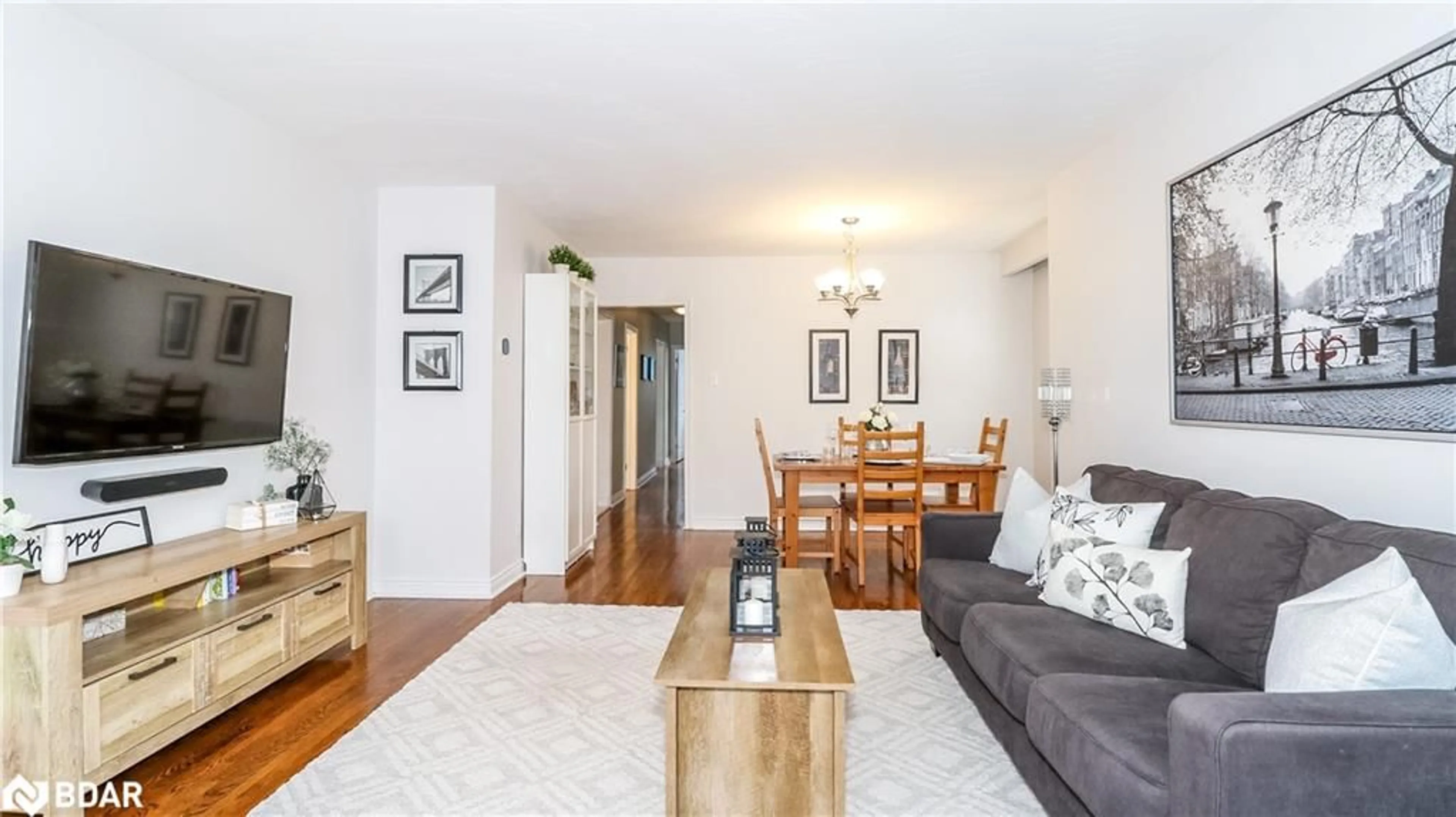 Living room with furniture, wood/laminate floor for 752 Silcote Rd, Mississauga Ontario L4Y 2R6