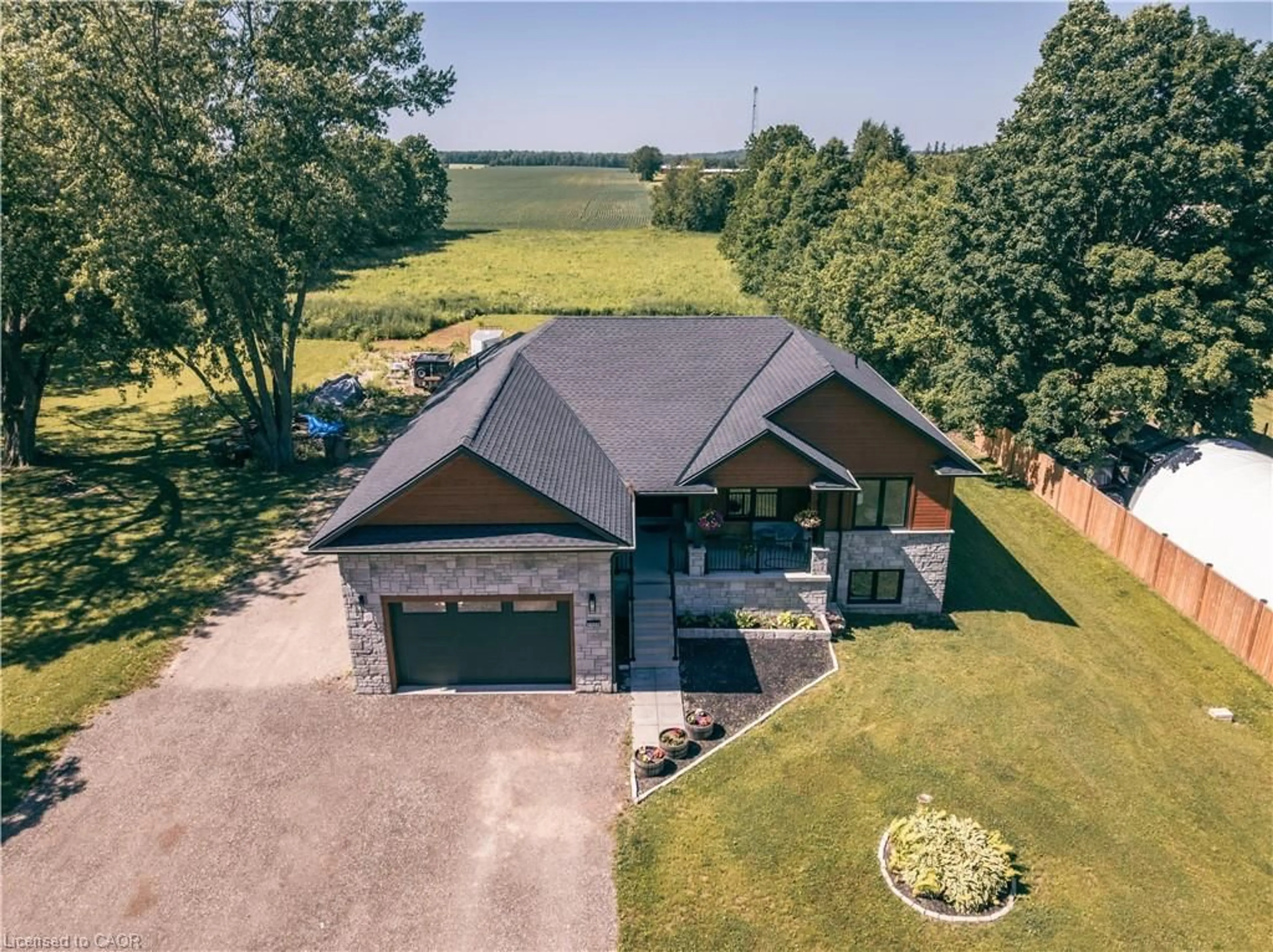 A pic from outside/outdoor area/front of a property/back of a property/a pic from drone, unknown for 1020 Victoria St, Ayton Ontario N0G 1C0