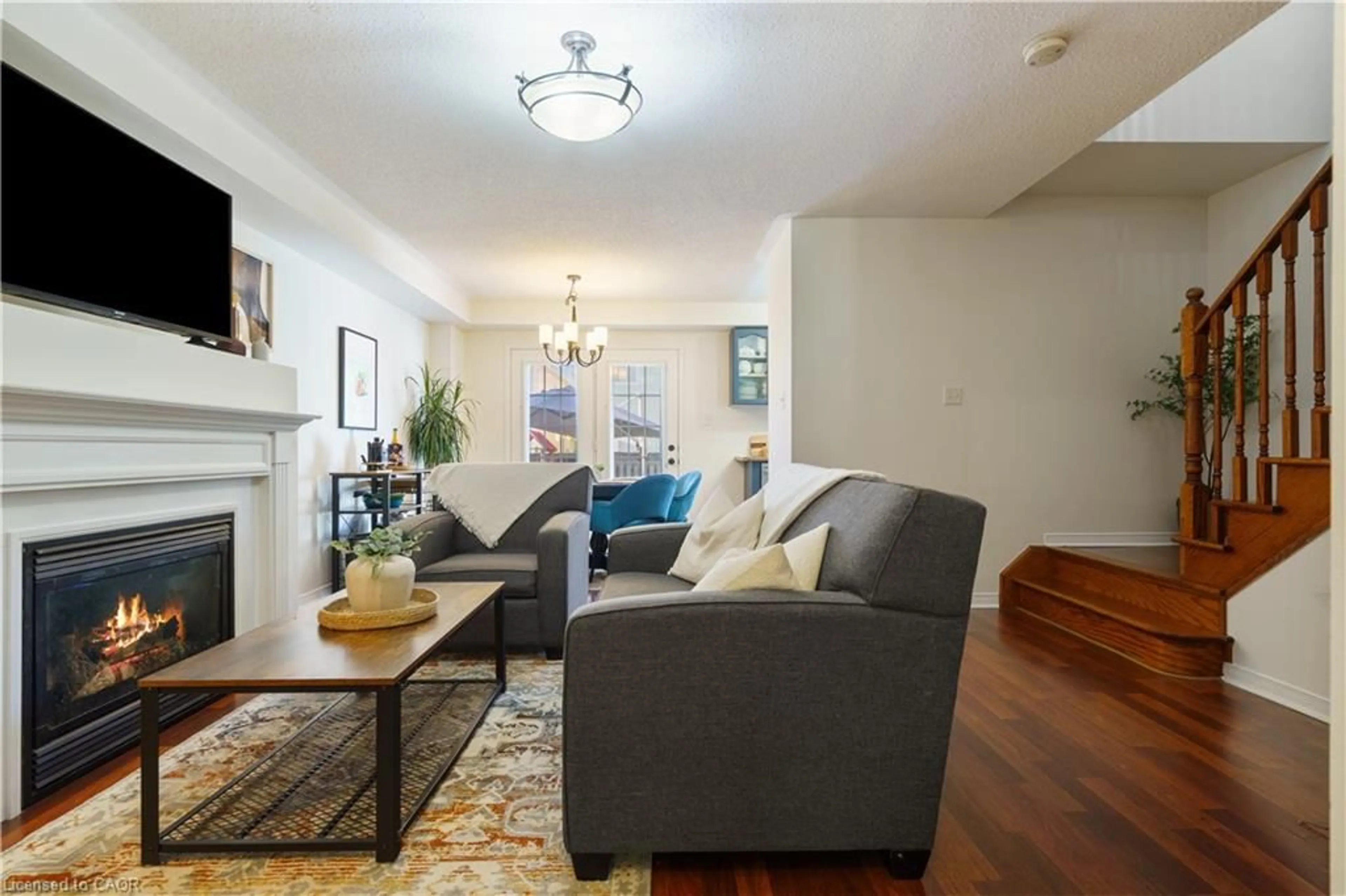 Living room with furniture, wood/laminate floor for 14 Fox Run, Waterdown Ontario L0R 2H8