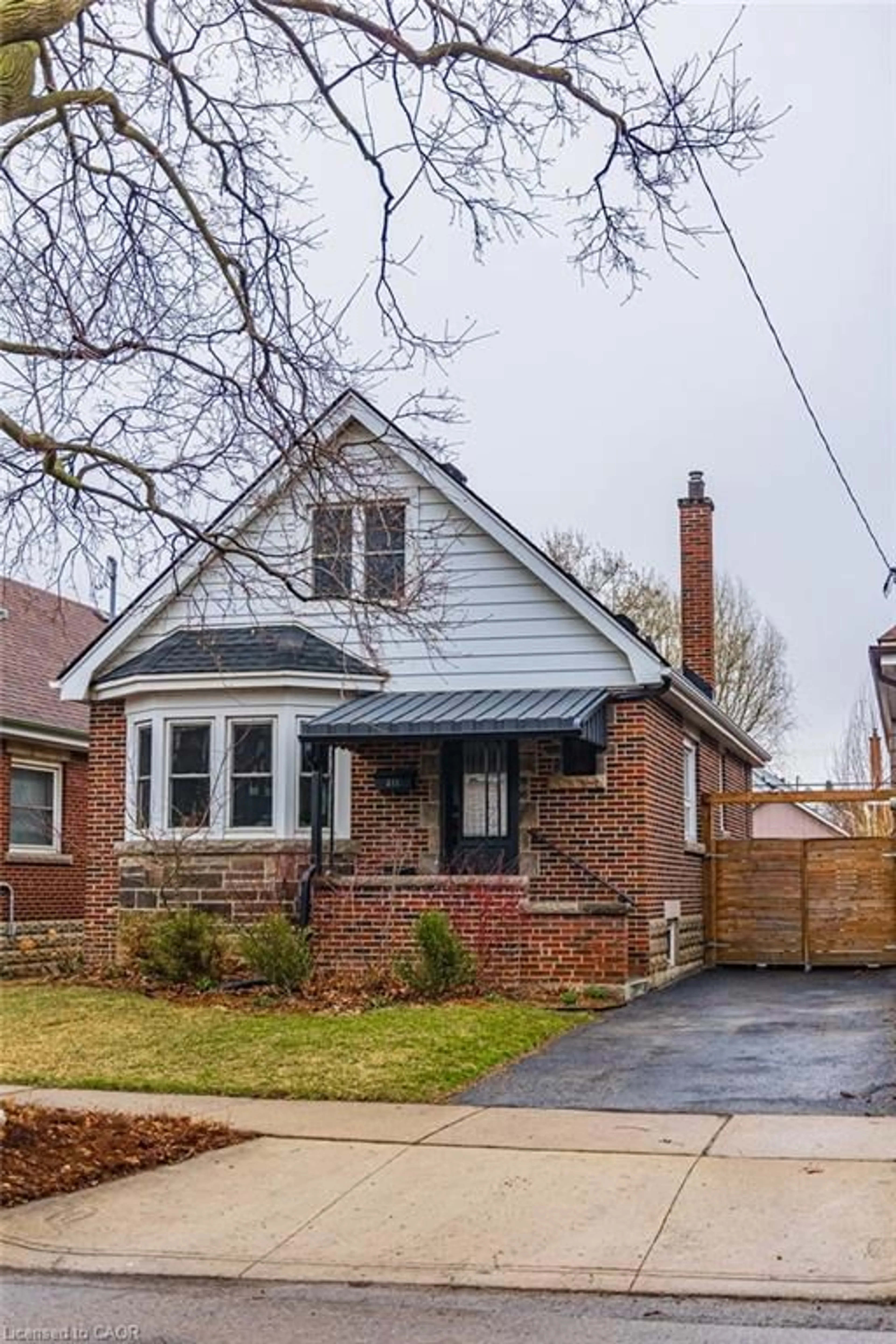 Home with brick exterior material, street for 211 Wexford Ave, Hamilton Ontario L8K 2P1