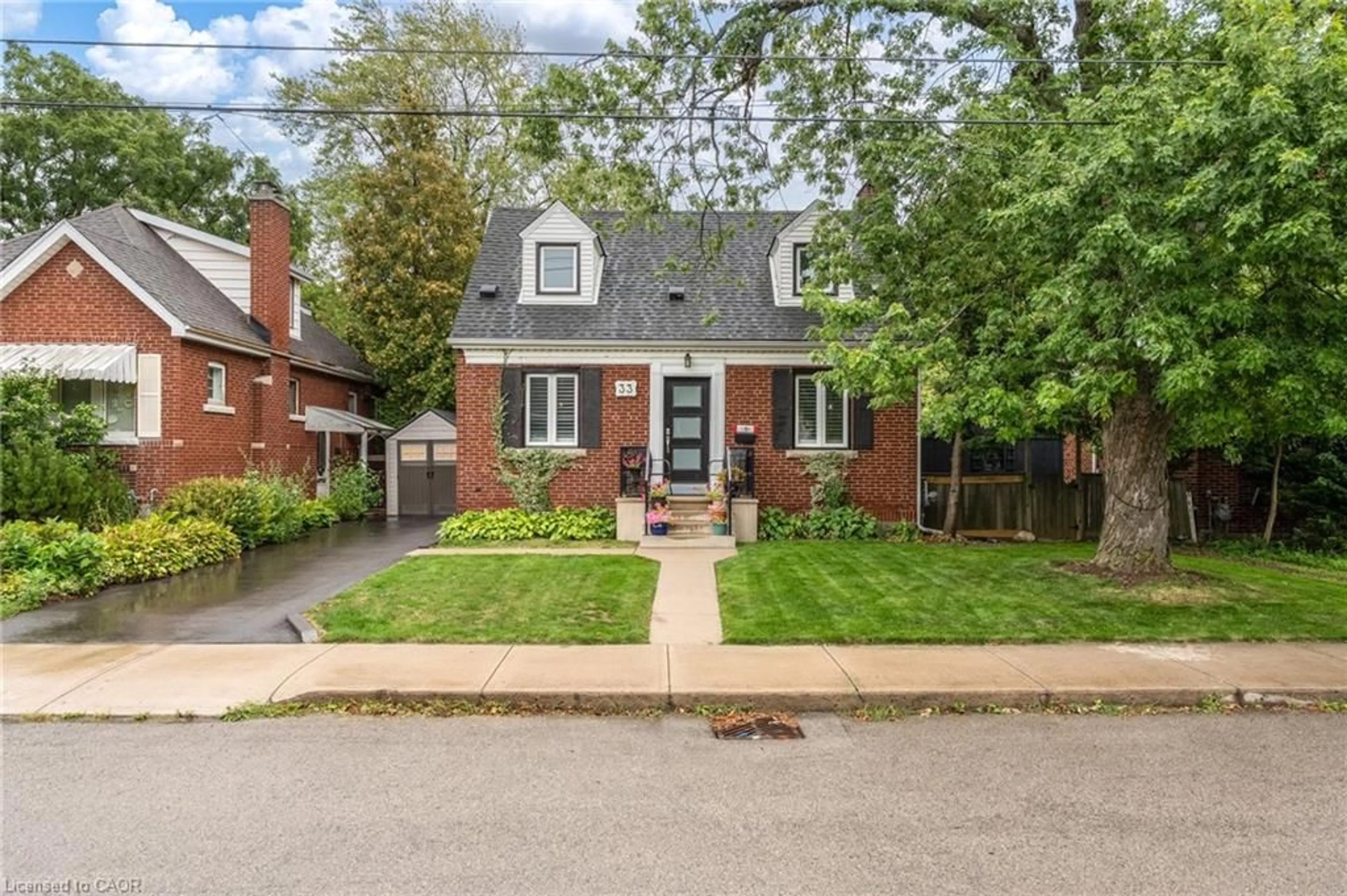 Home with brick exterior material, street for 33 East 12th St, Hamilton Ontario L9A 3X2