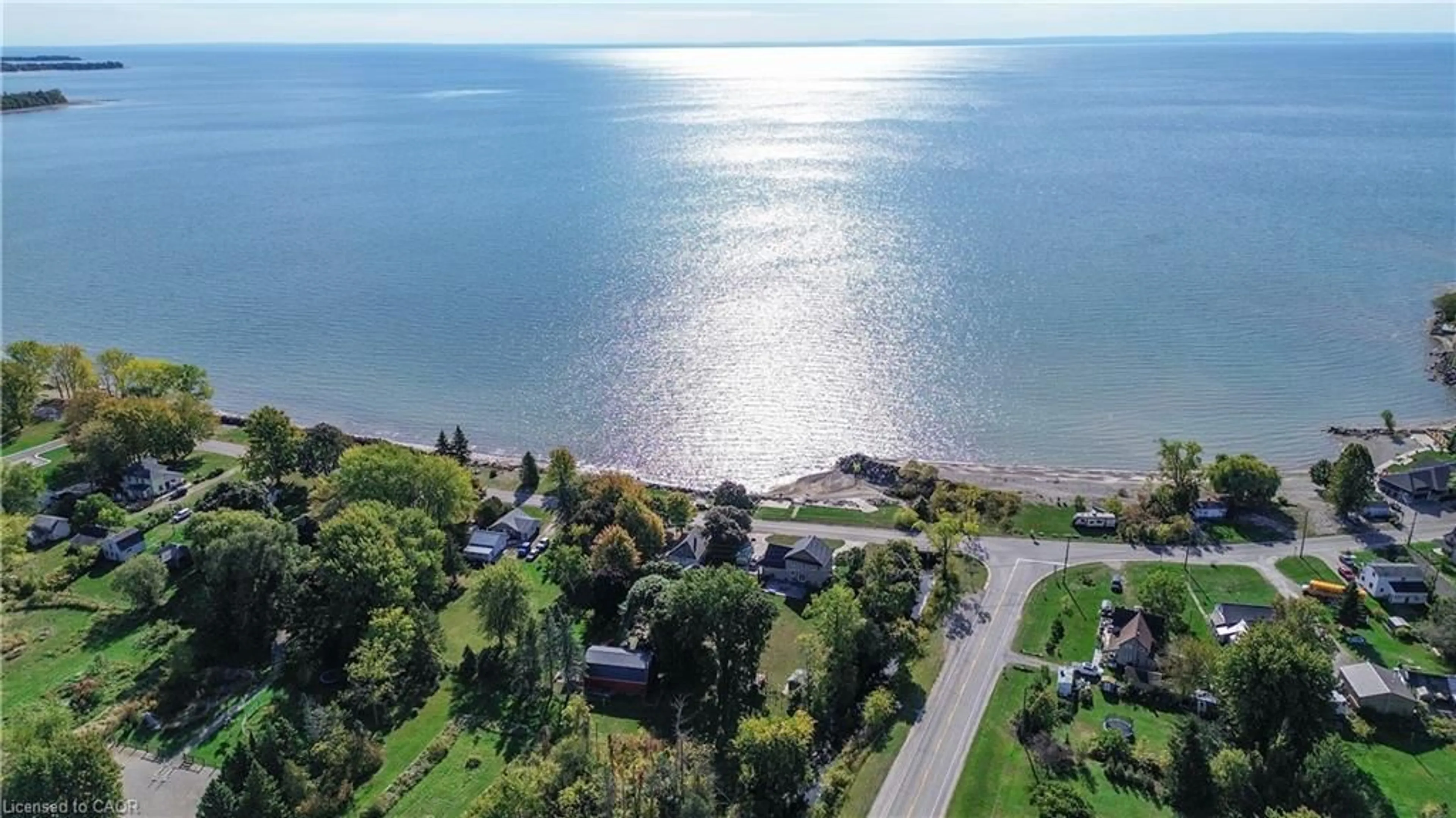 A pic from outside/outdoor area/front of a property/back of a property/a pic from drone, water/lake/river/ocean view for 2801 North Shore Dr, Lowbanks Ontario N0A 1K0
