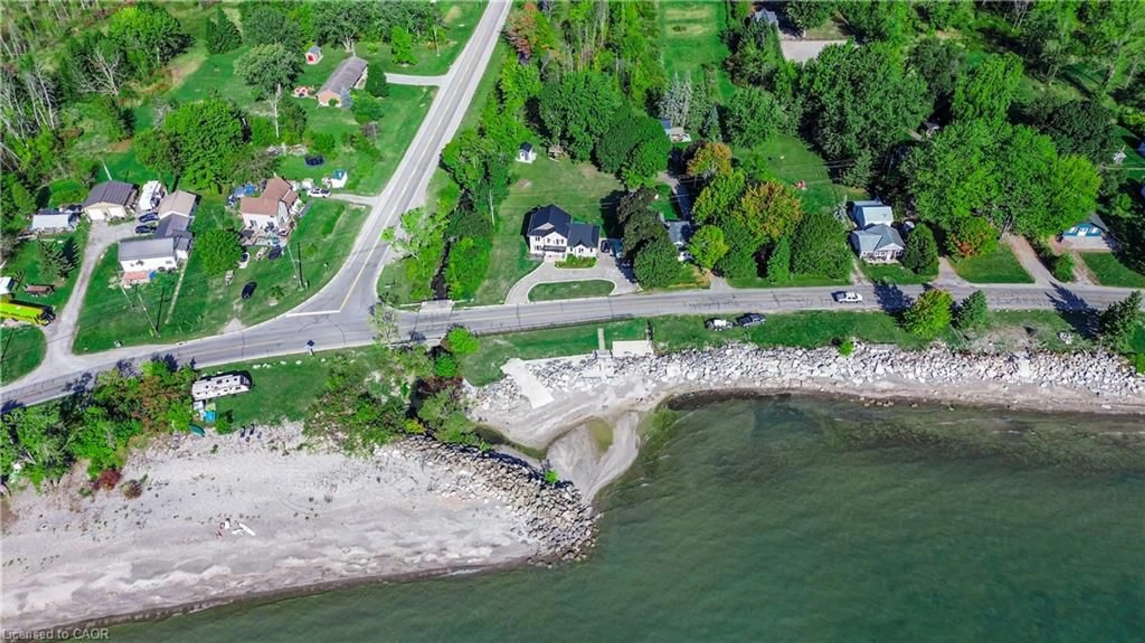 A pic from outside/outdoor area/front of a property/back of a property/a pic from drone, water/lake/river/ocean view for 2801 North Shore Dr, Lowbanks Ontario N0A 1K0