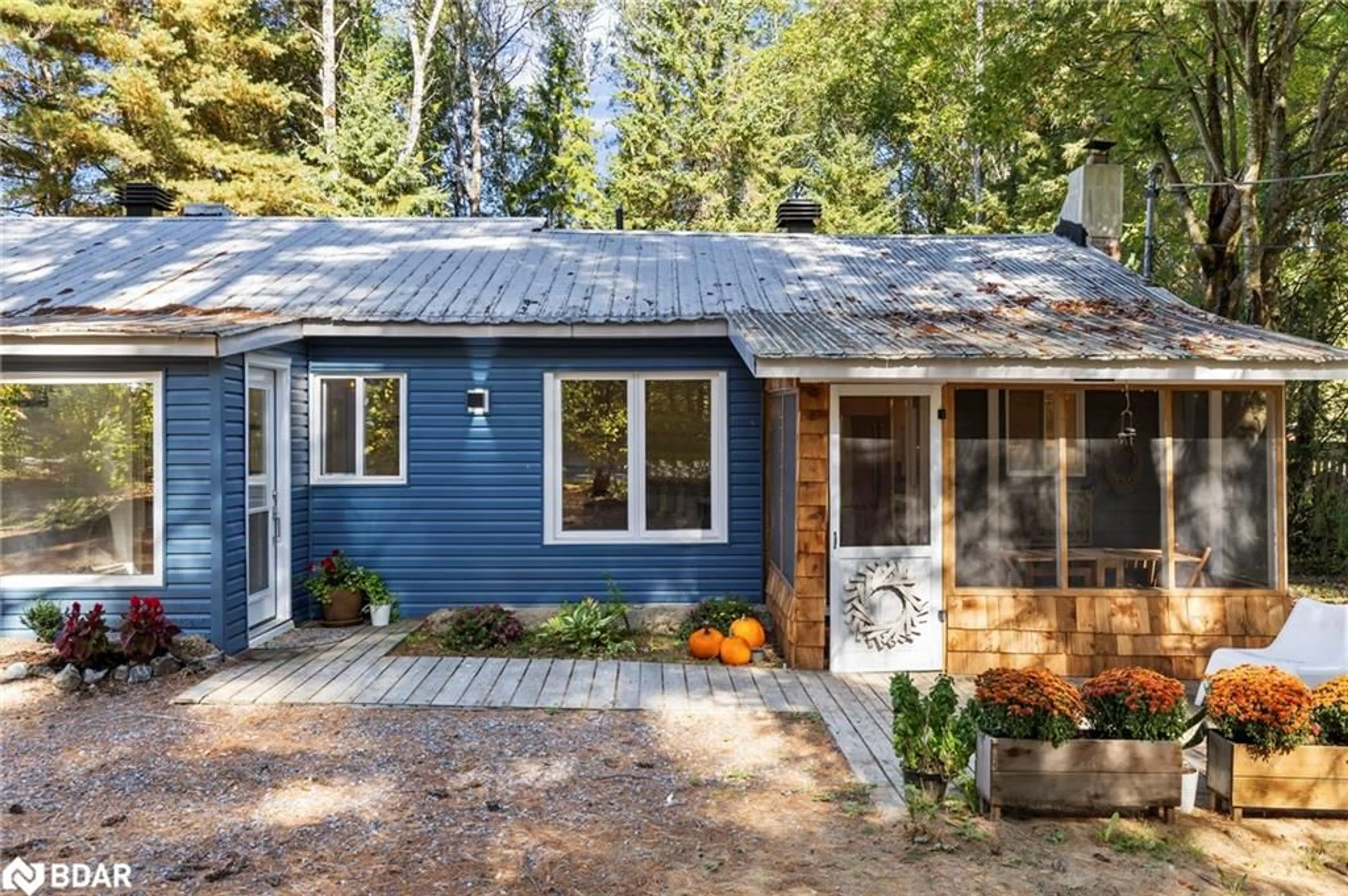Home with vinyl exterior material, street for 328 Muskoka Road 10 Rd, Port Sydney Ontario P0B 1L0