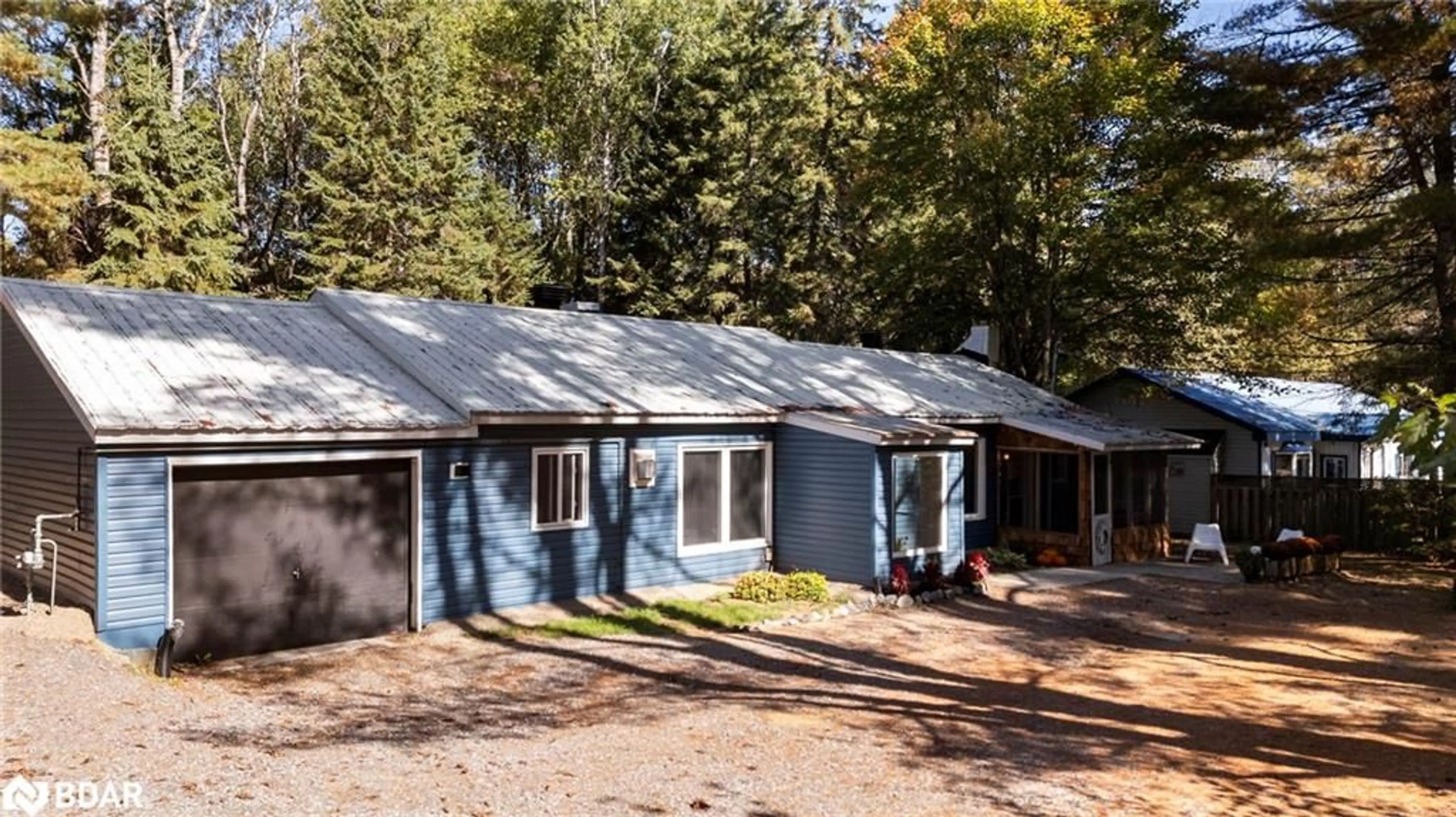 Home with vinyl exterior material, street for 328 Muskoka Road 10 Rd, Port Sydney Ontario P0B 1L0