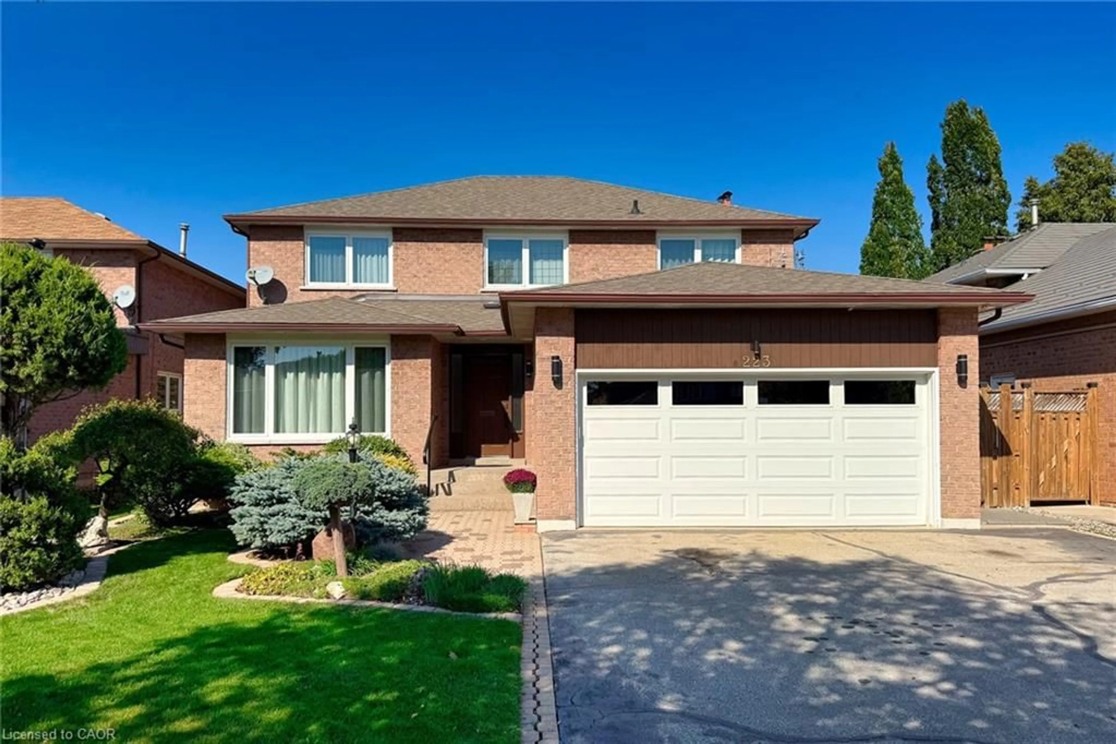 Home with brick exterior material, street for 223 River Oaks Blvd, Oakville Ontario L6H 3V2