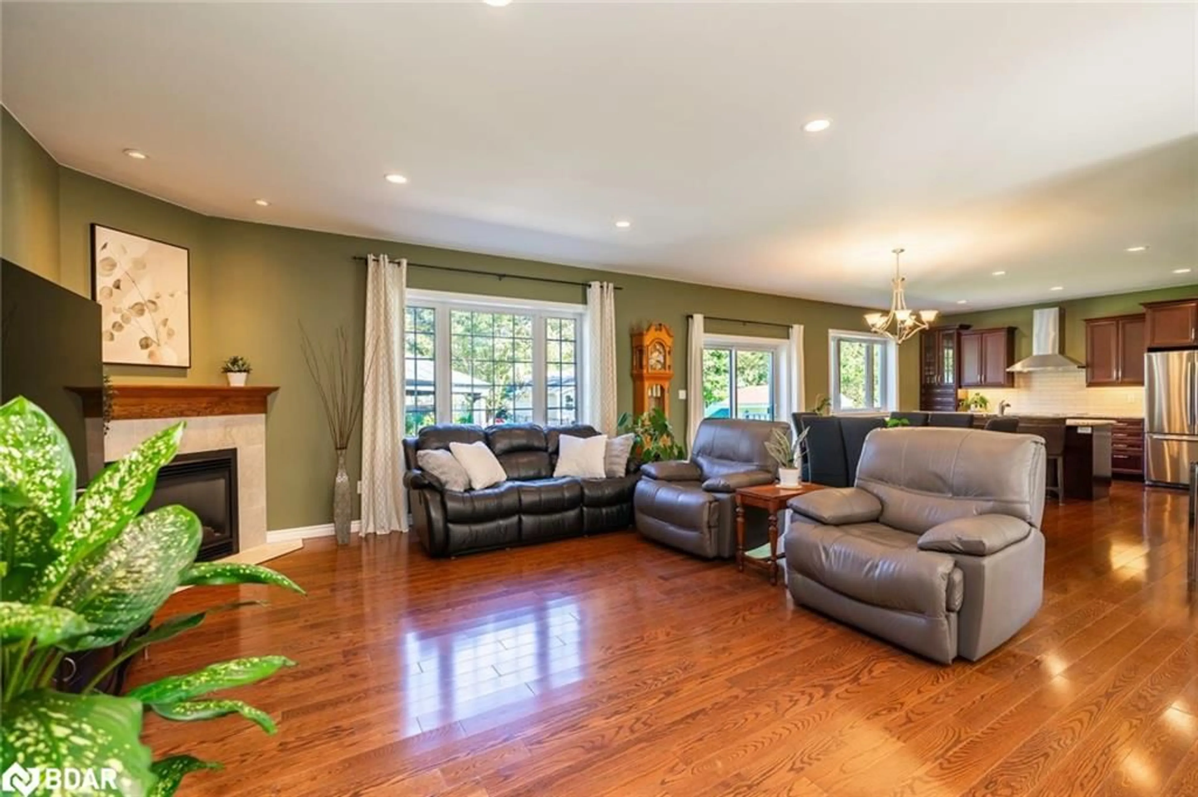 Living room with furniture, wood/laminate floor for 222 Glenn Ave, Stroud Ontario L9S 1C4
