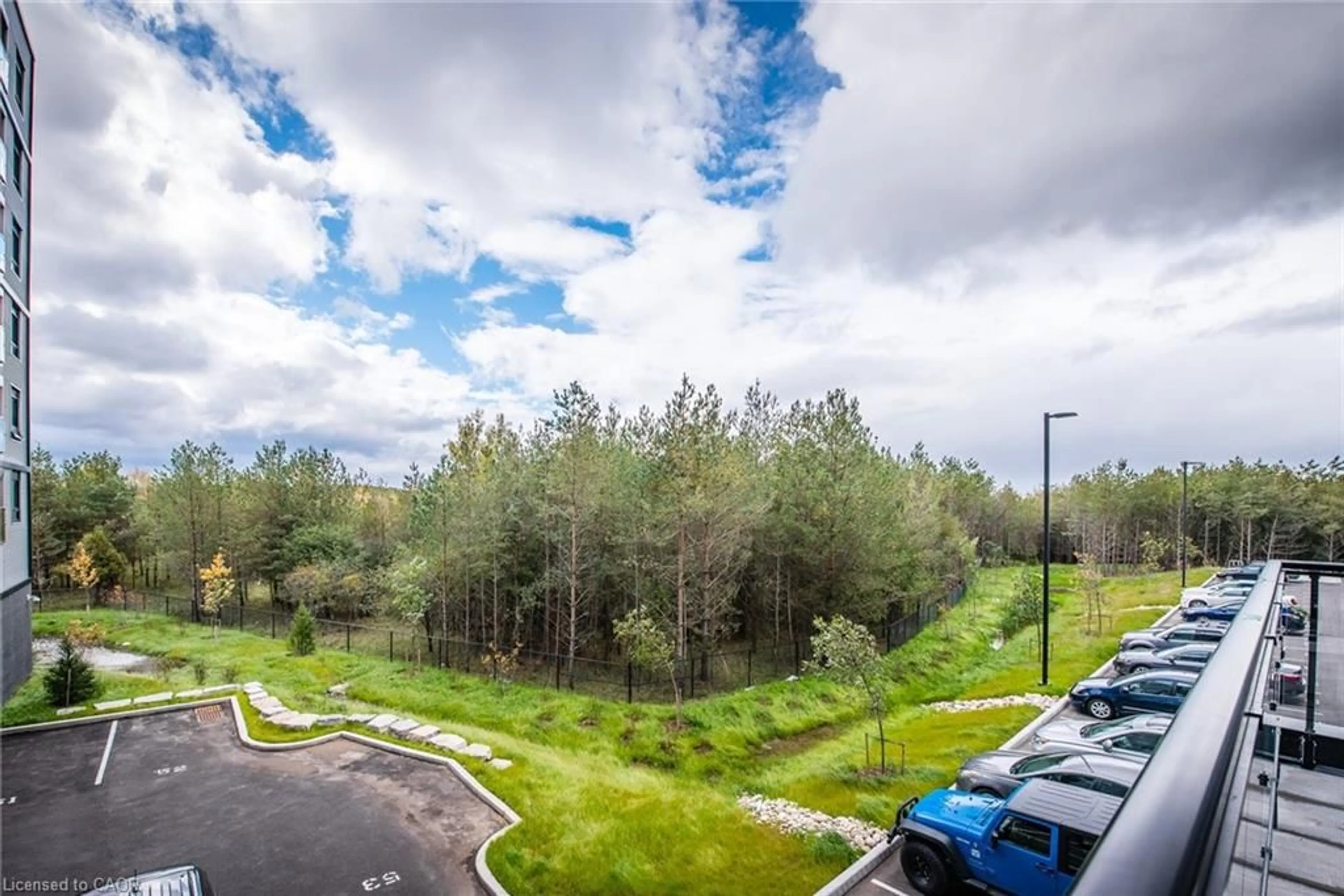 A pic from outside/outdoor area/front of a property/back of a property/a pic from drone, forest/trees view for 1291 Gordon St #220, Guelph Ontario N1L 0M5