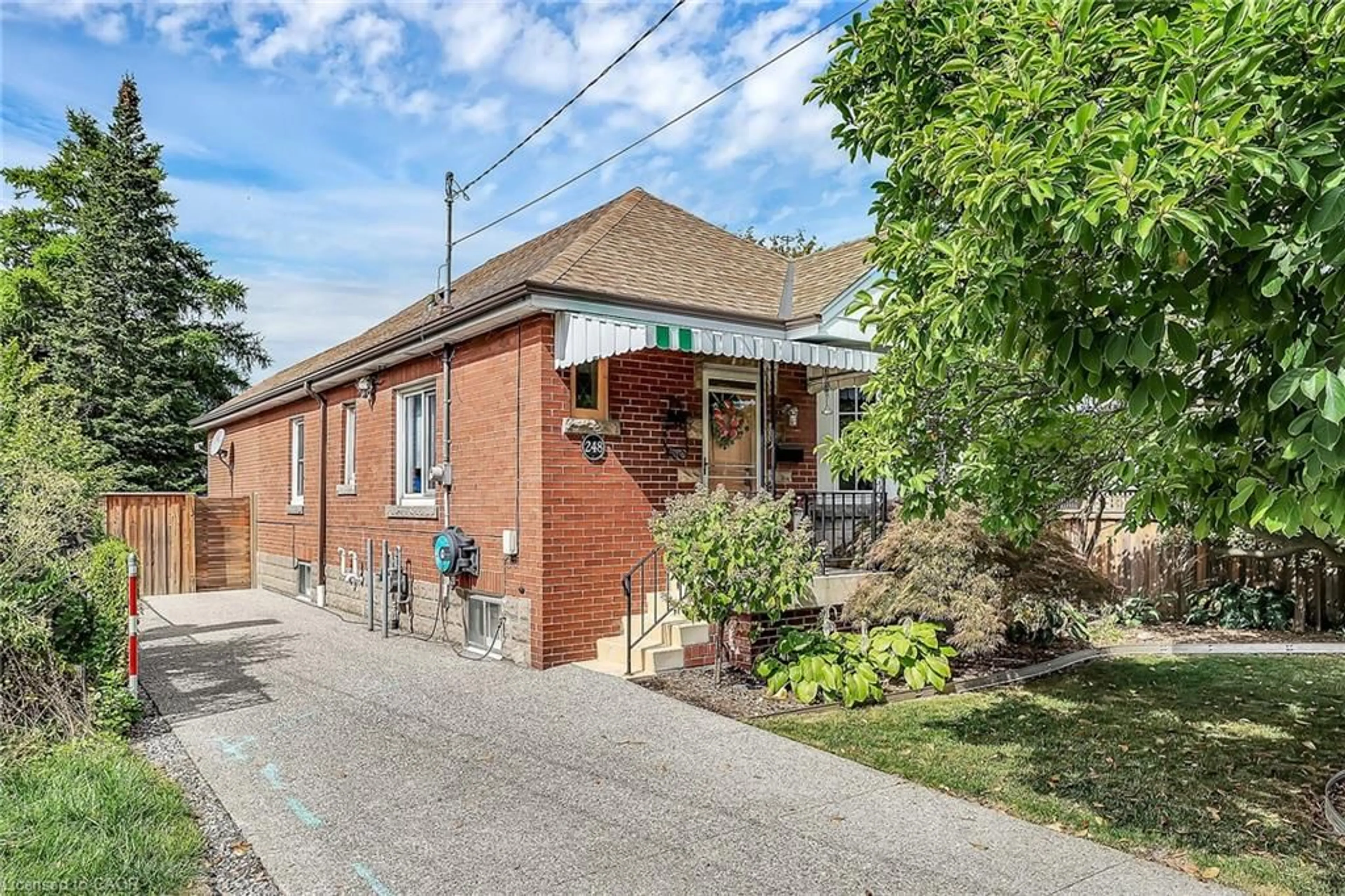 Home with brick exterior material, street for 248 East 12th St, Hamilton Ontario L9A 3X8