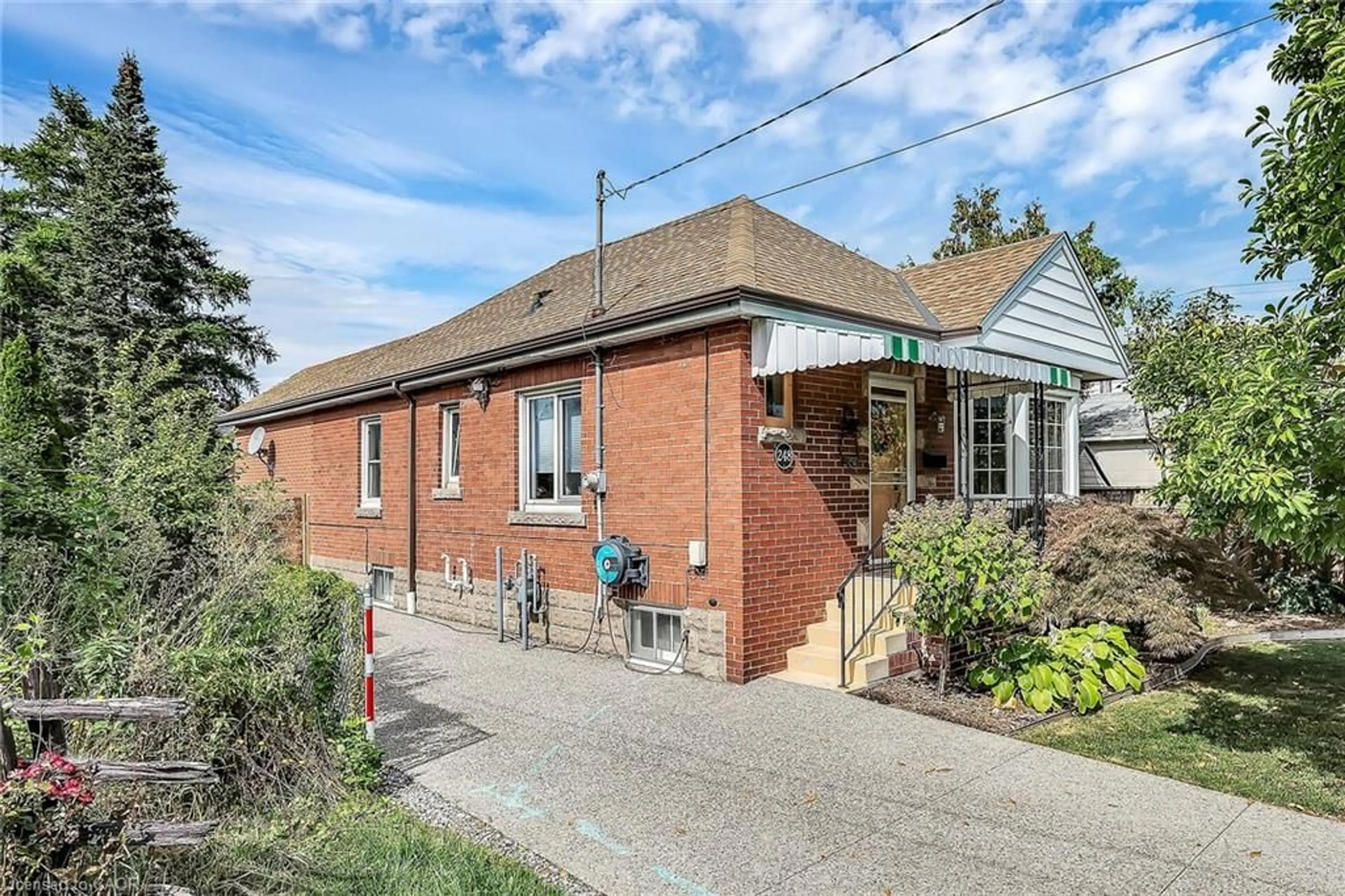 Home with brick exterior material, street for 248 East 12th St, Hamilton Ontario L9A 3X8