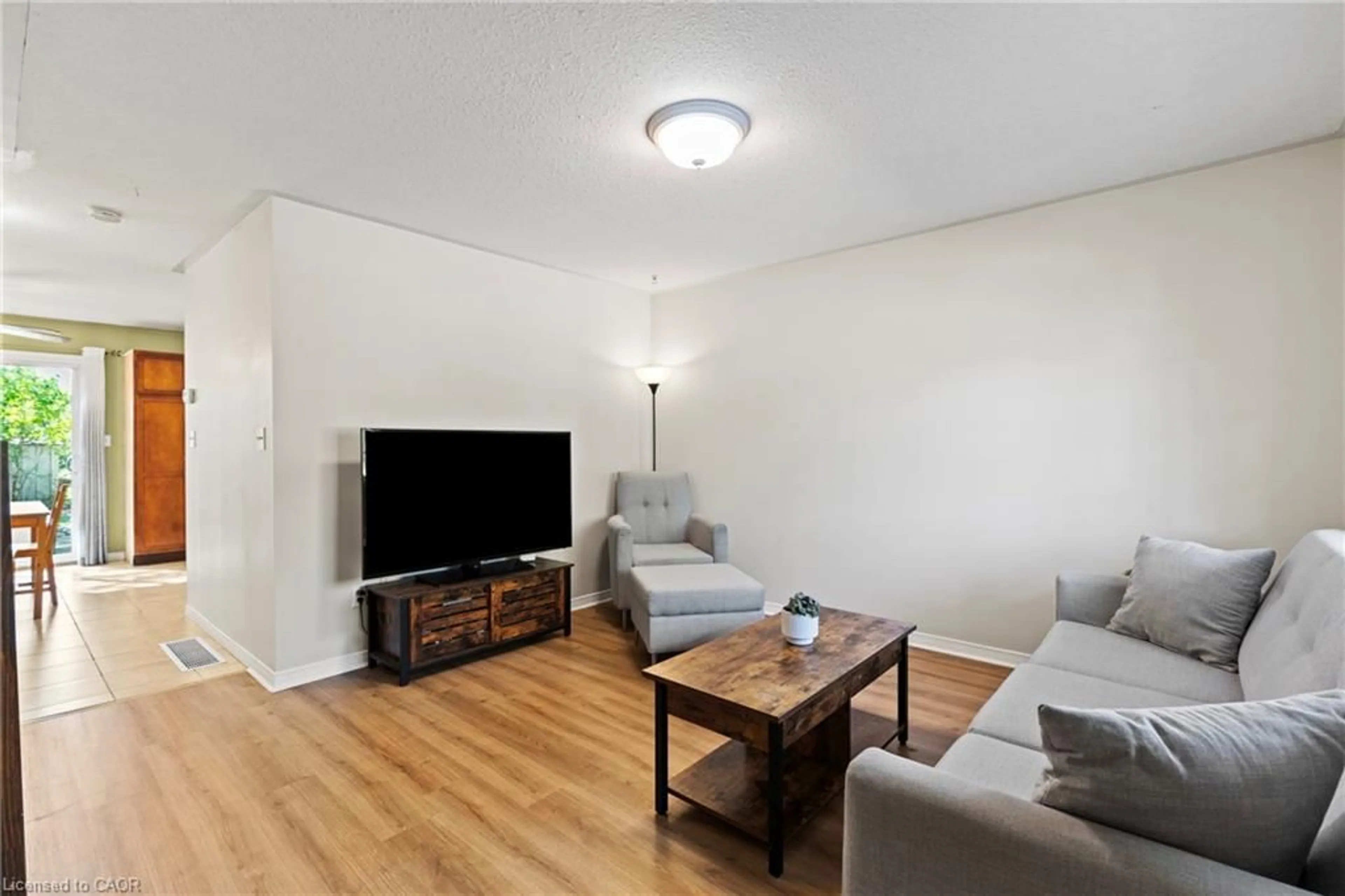 Living room with furniture, wood/laminate floor for 74 Grand River Ave, Brantford Ontario N3T 4X4