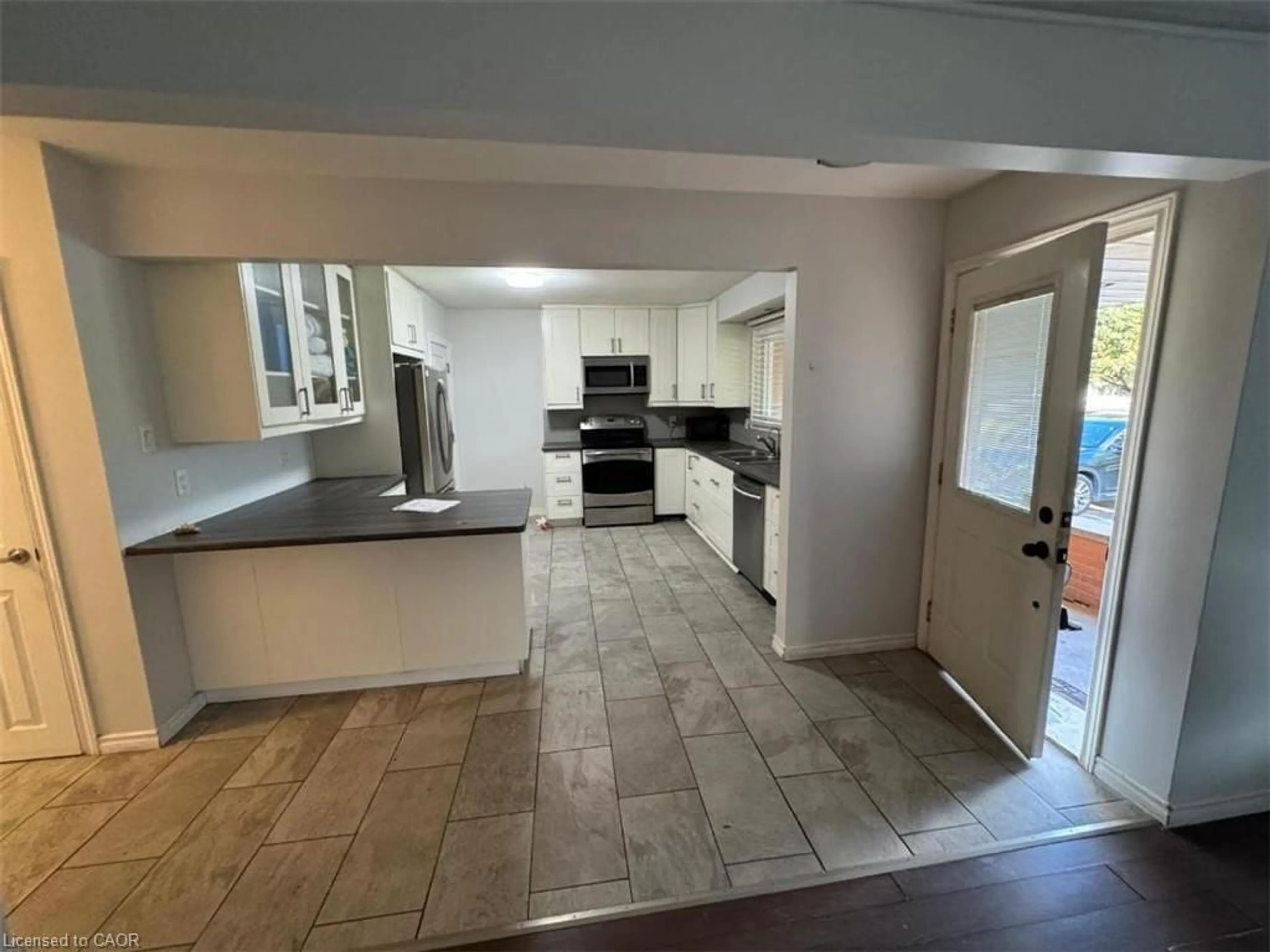 Open concept kitchen, ceramic/tile floor for 276 Erb St, Waterloo Ontario N2J 1N7