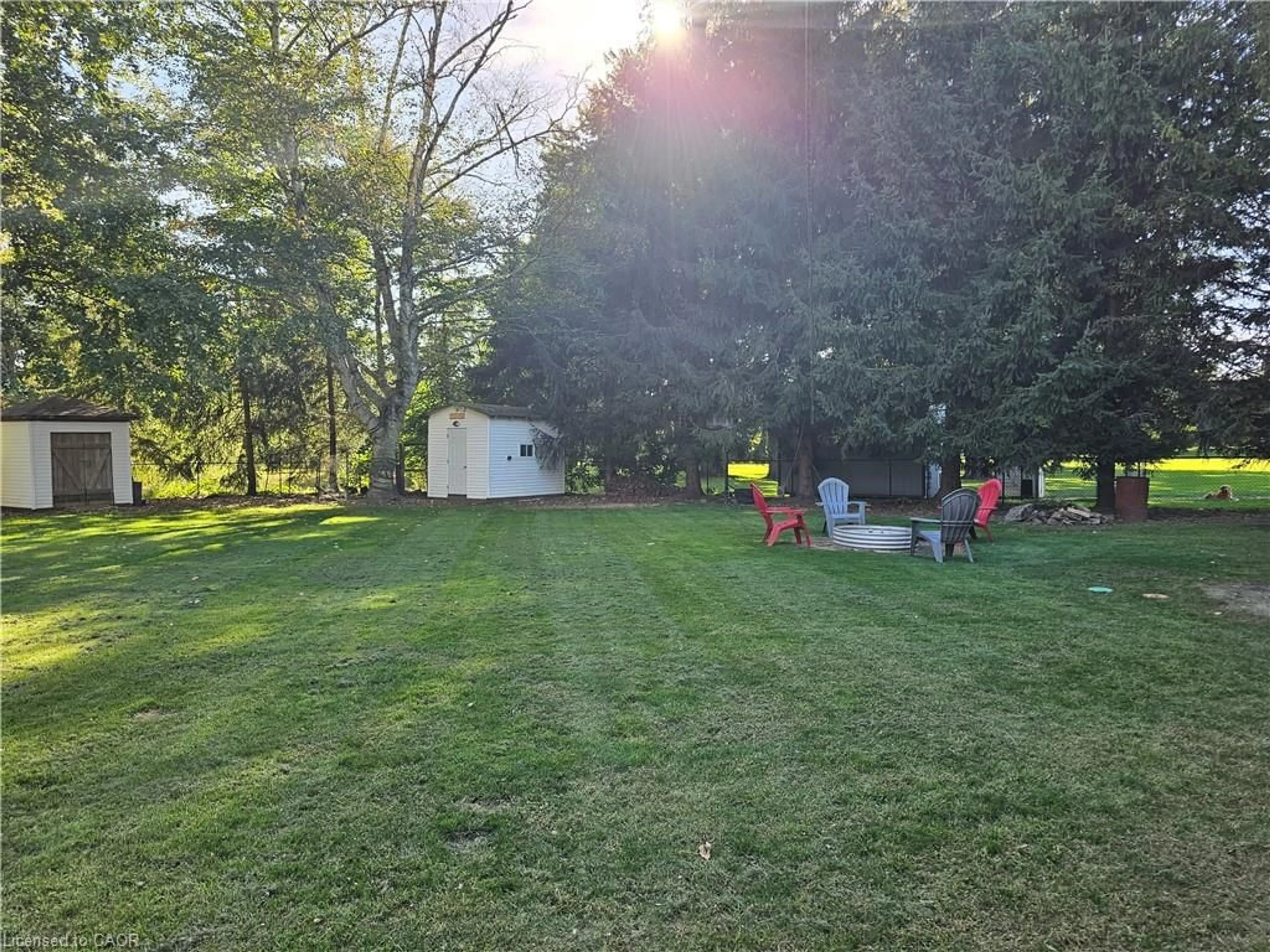 A pic from outside/outdoor area/front of a property/back of a property/a pic from drone, forest/trees view for 23632 Zone Rd 1, Thamesville Ontario N0P 2K0