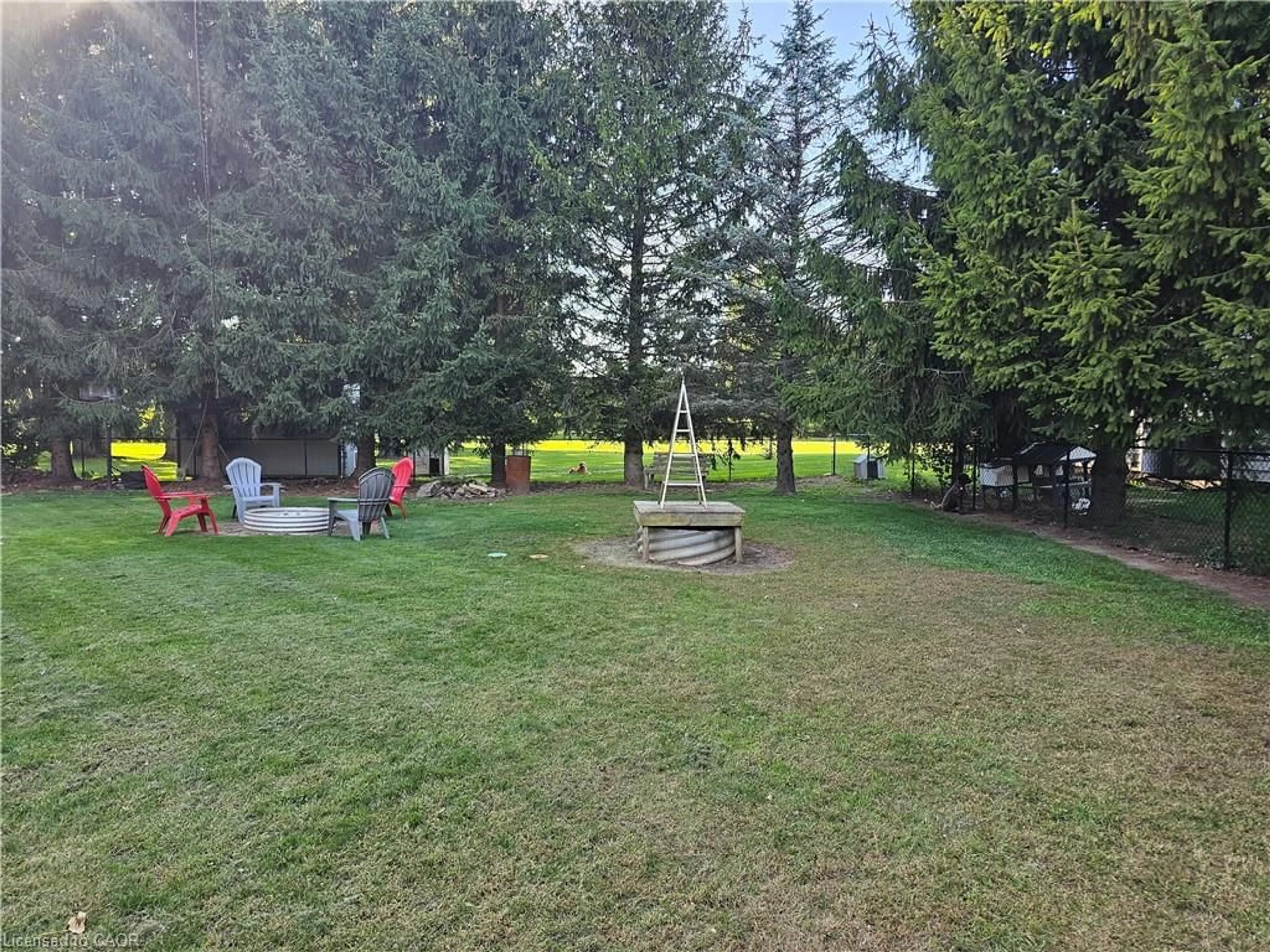 A pic from outside/outdoor area/front of a property/back of a property/a pic from drone, forest/trees view for 23632 Zone Rd 1, Thamesville Ontario N0P 2K0