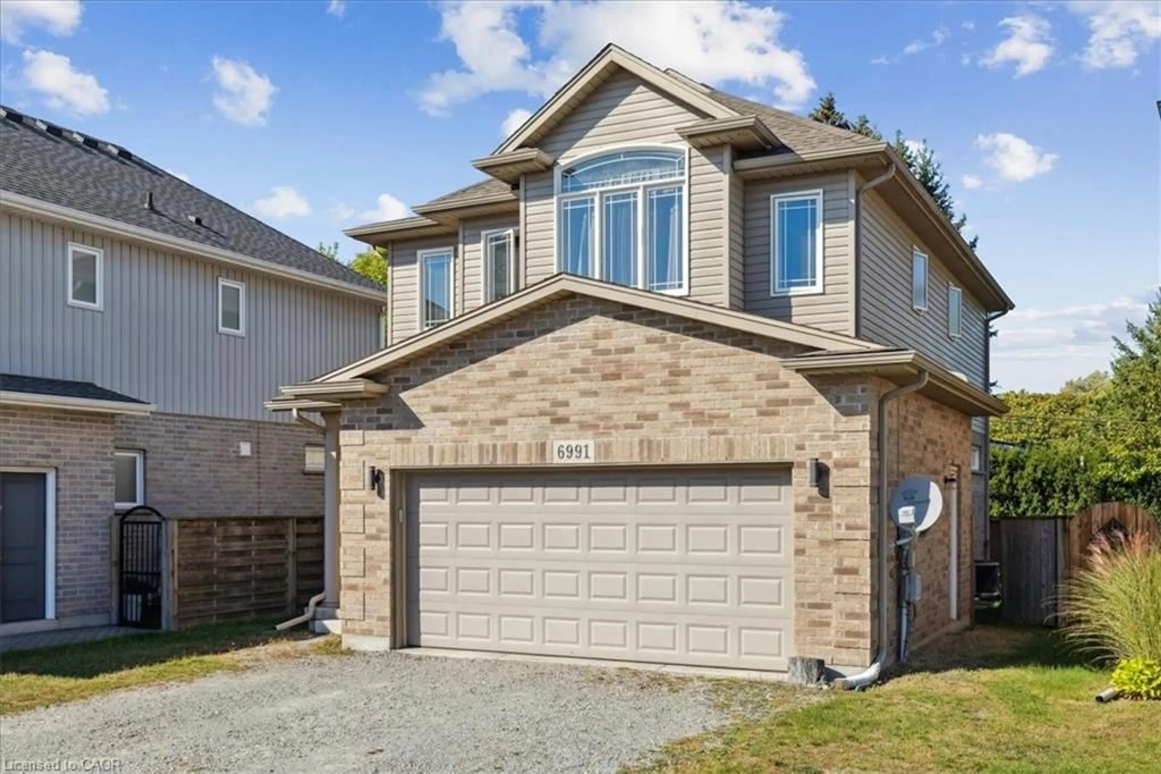 Home with brick exterior material, street for 6991 Optimist Lane, Niagara Falls Ontario L2E 0B1