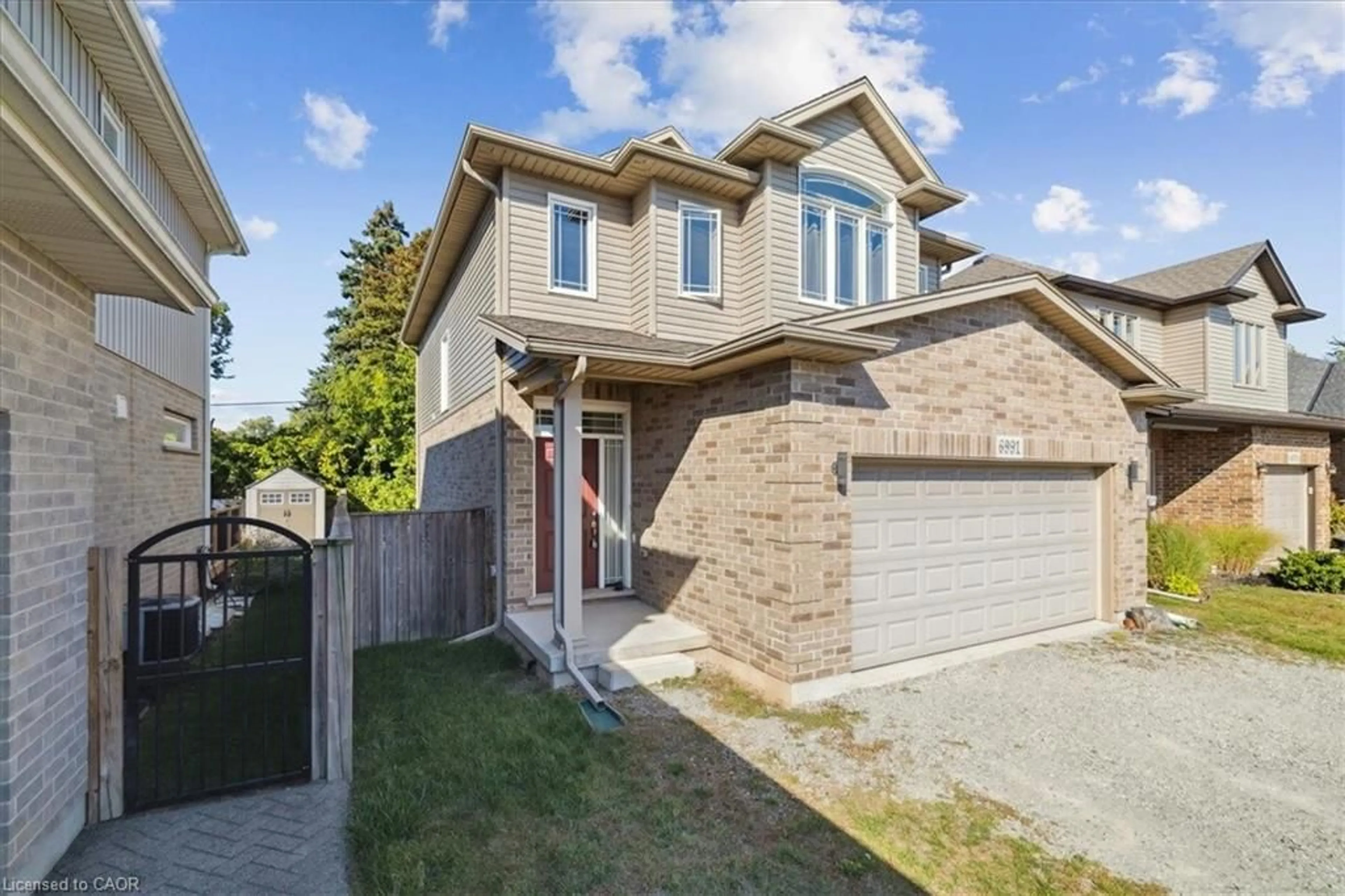 Home with brick exterior material, street for 6991 Optimist Lane, Niagara Falls Ontario L2E 0B1