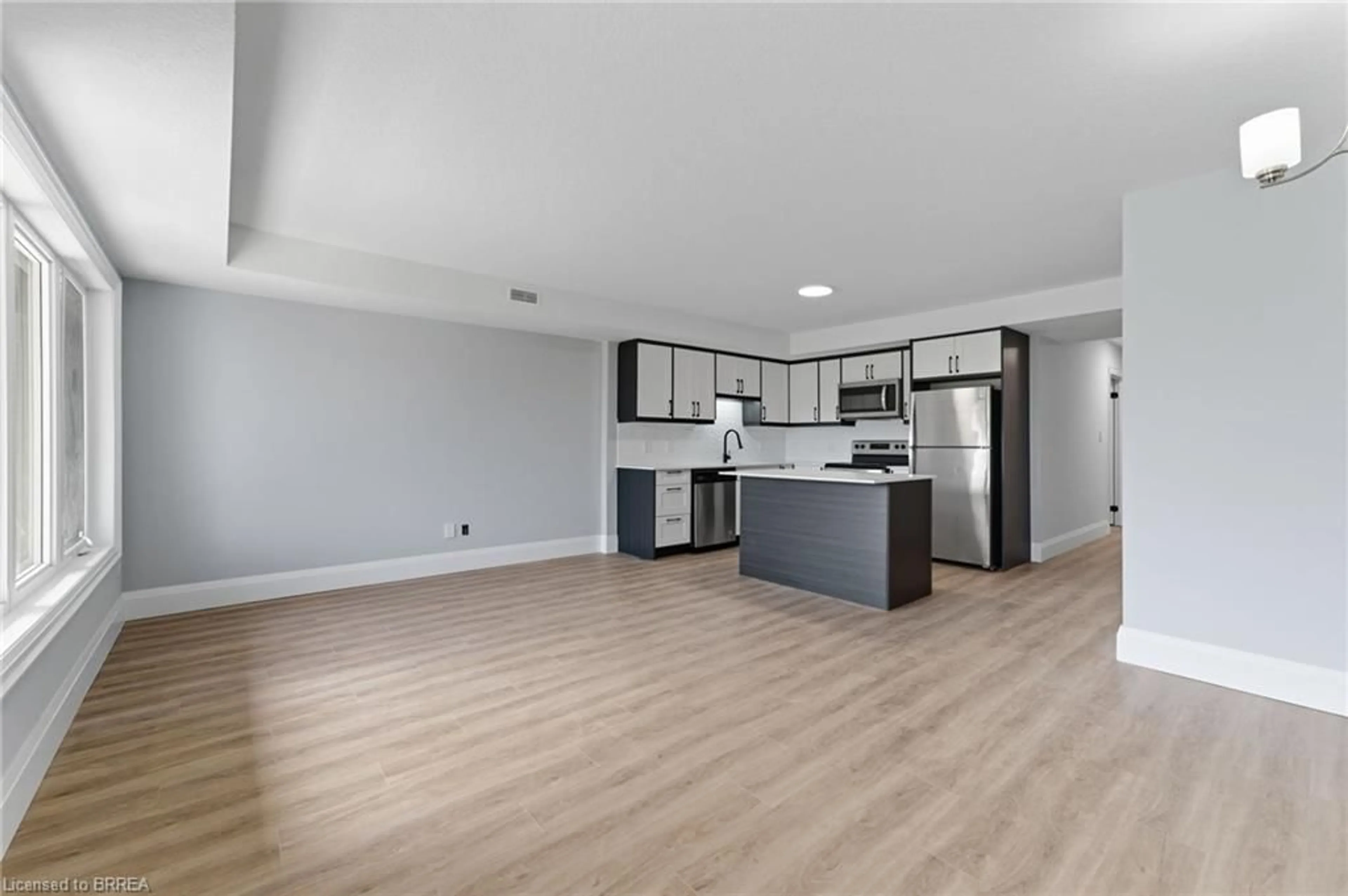 Open concept kitchen, wood/laminate floor for 160 Rochefort Street St #A17, Kitchener Ontario N2R 0P5
