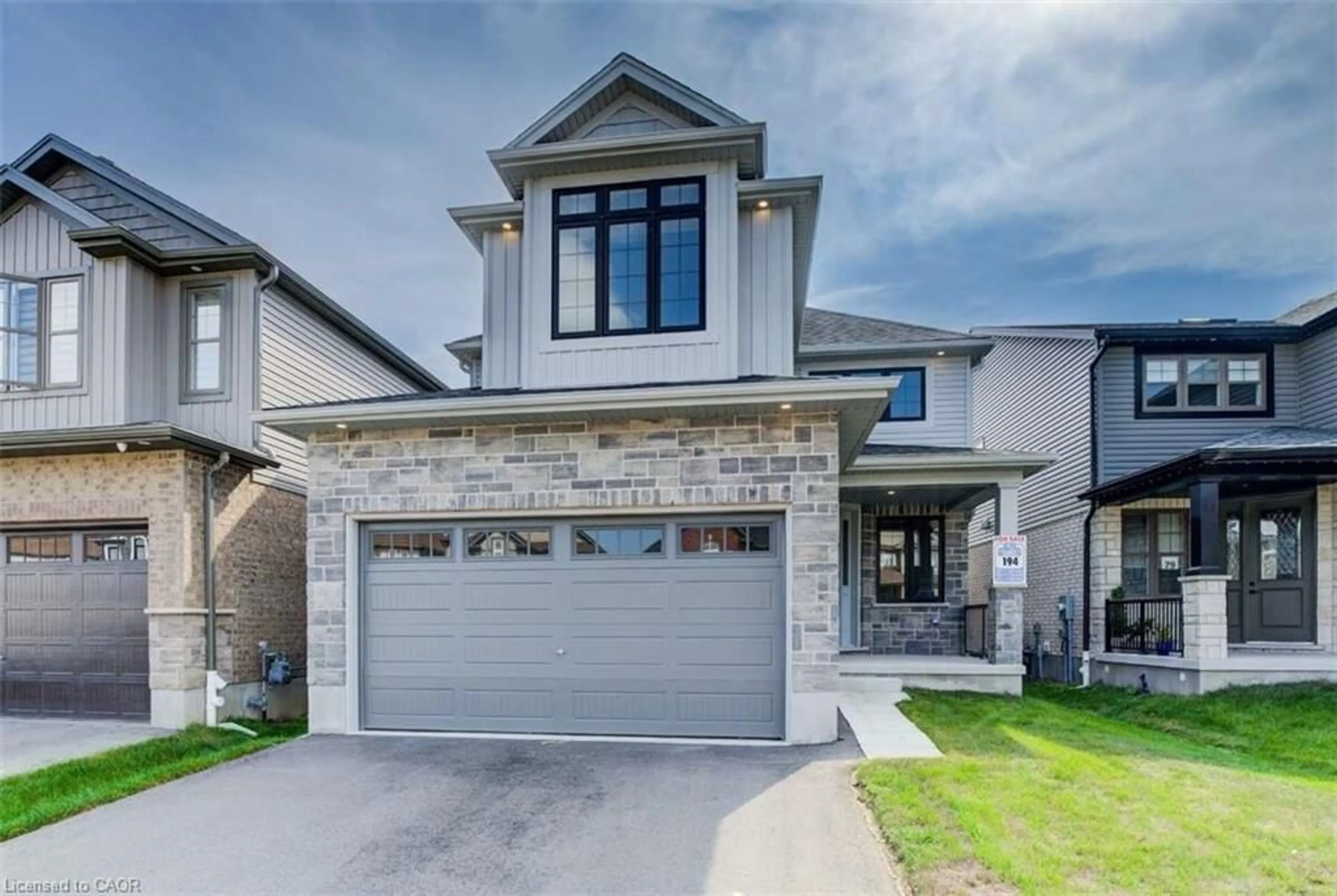 Home with brick exterior material, street for 83 Crosswinds Dr, Kitchener Ontario N2A 0J9