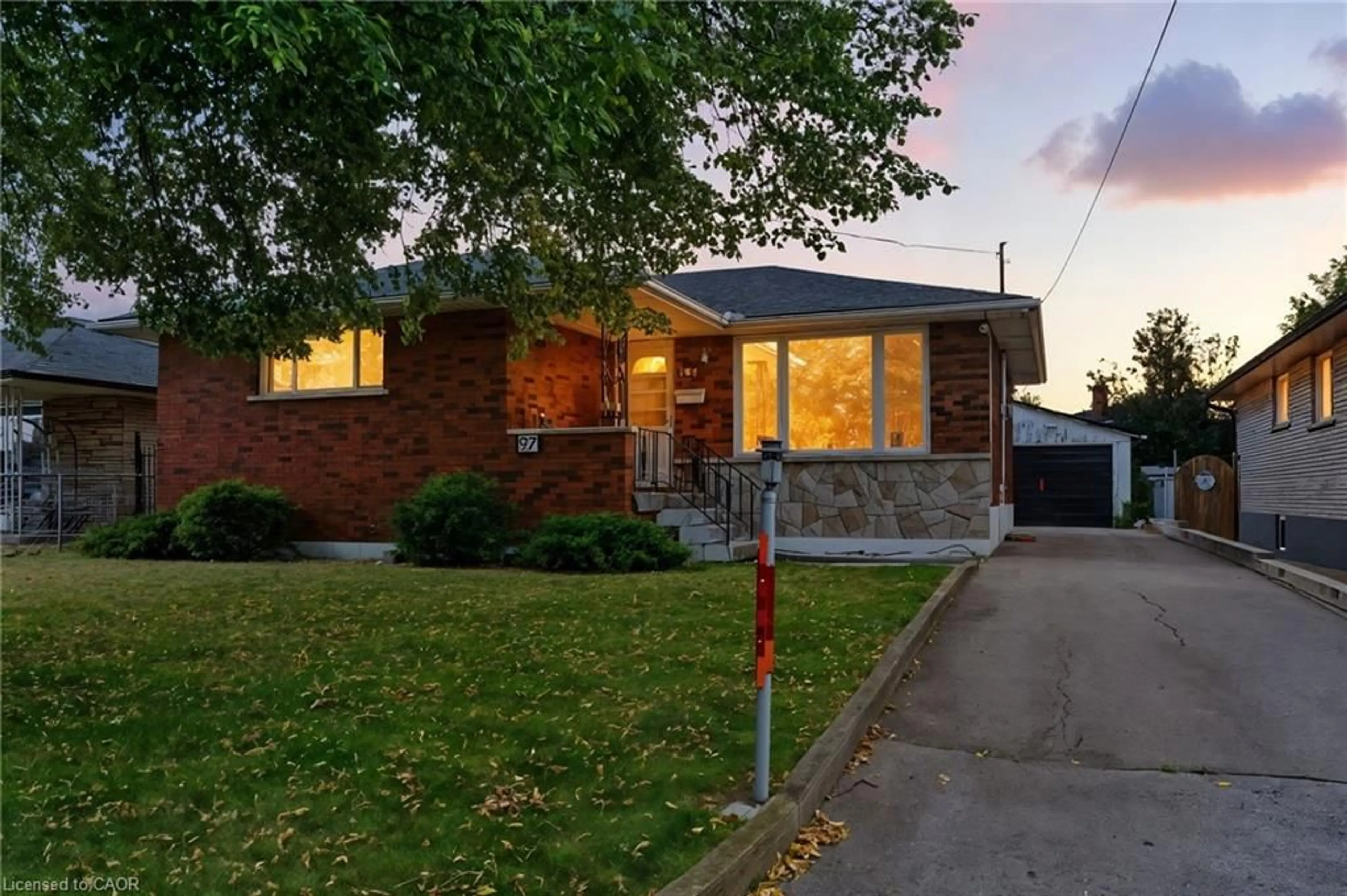 Home with brick exterior material, street for 97 Kenora Ave, Hamilton Ontario L8E 1C3