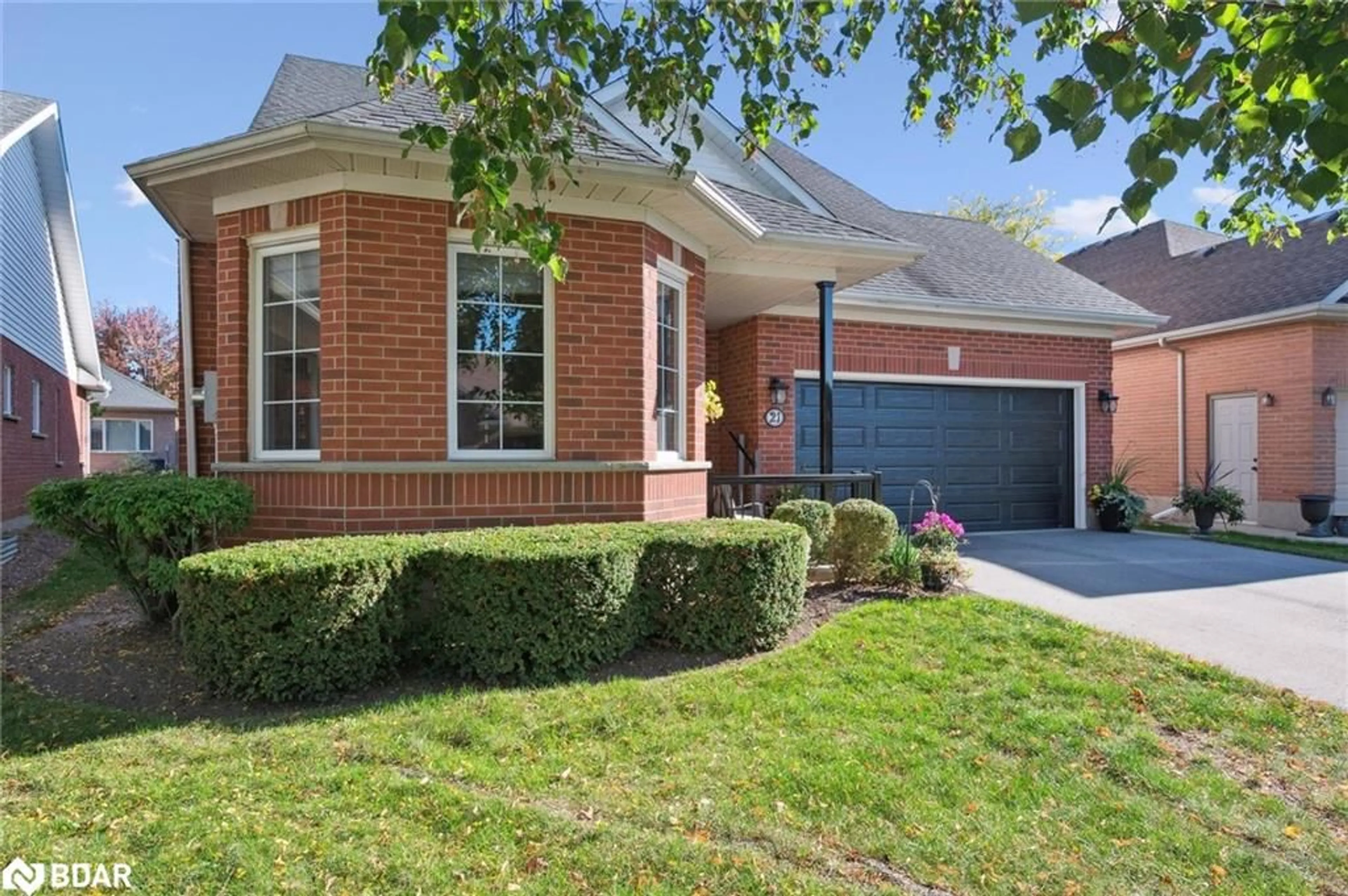 Home with brick exterior material, street for 21 Cherry Blossom Circle, Guelph Ontario N1G 4X7