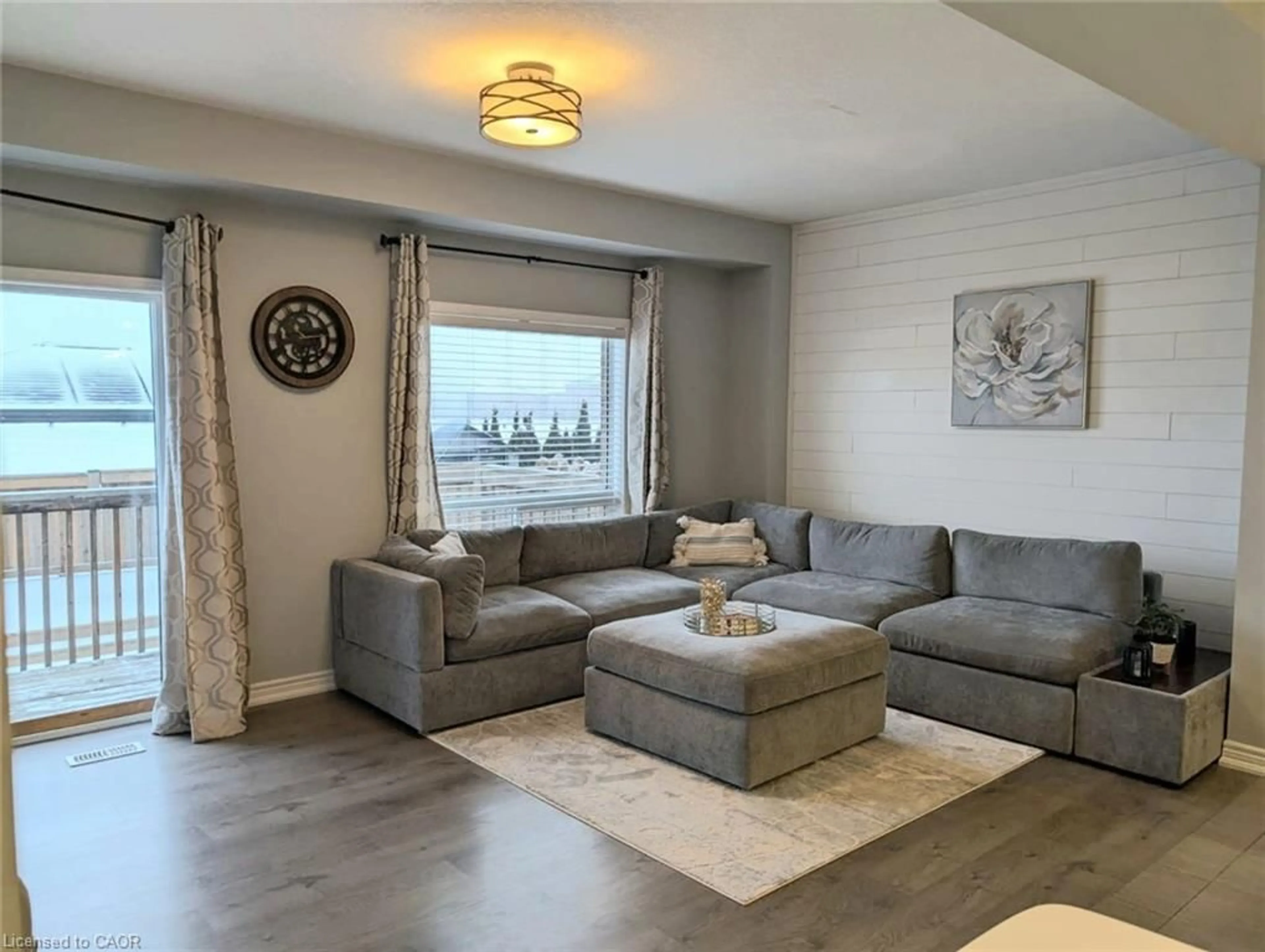 Living room with furniture, wood/laminate floor for 137 Lormont Blvd, Stoney Creek Ontario L8J 0K2