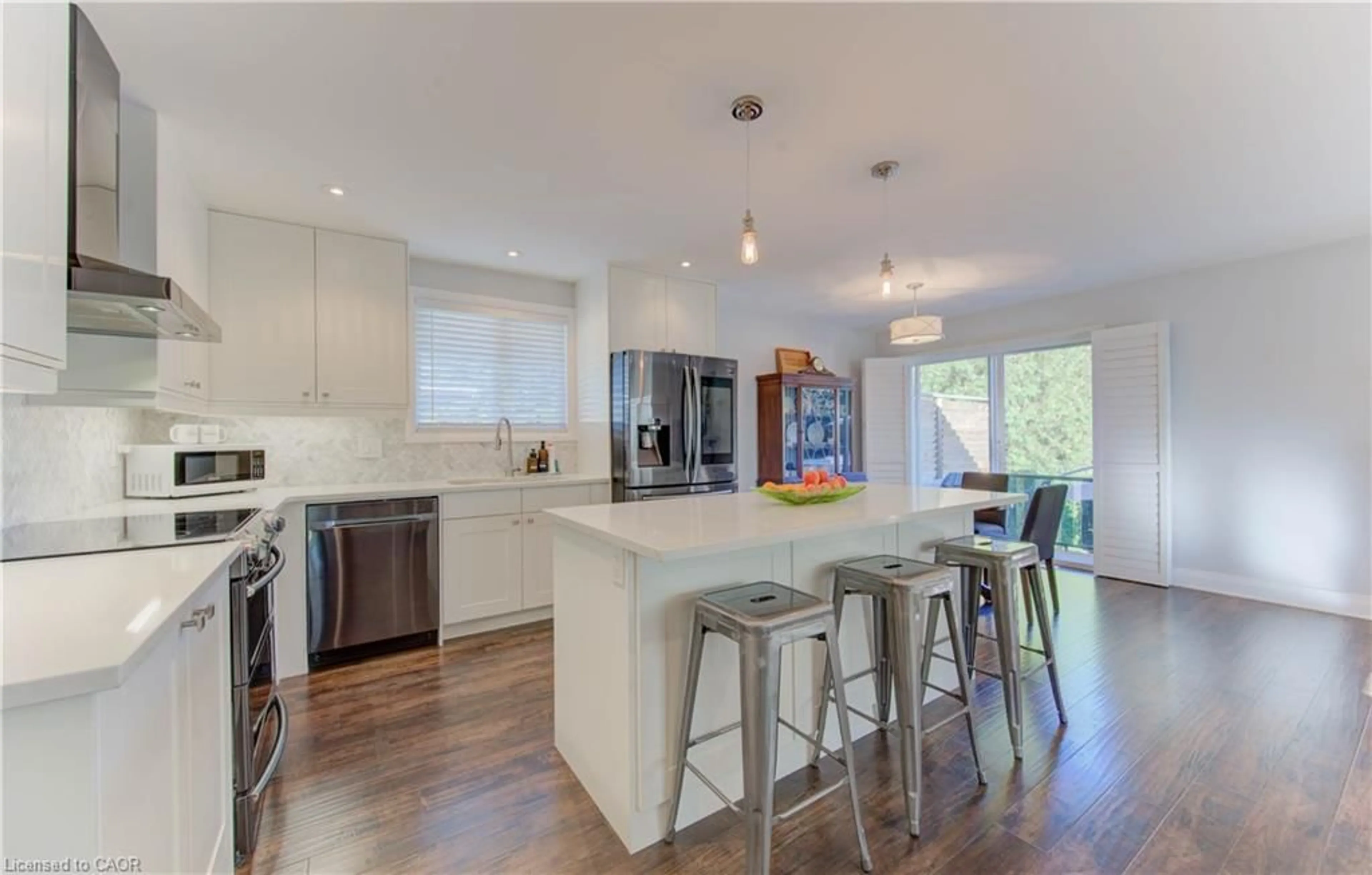 Open concept kitchen, wood/laminate floor for 292 Parkmount Dr, Waterloo Ontario N2L 5S2