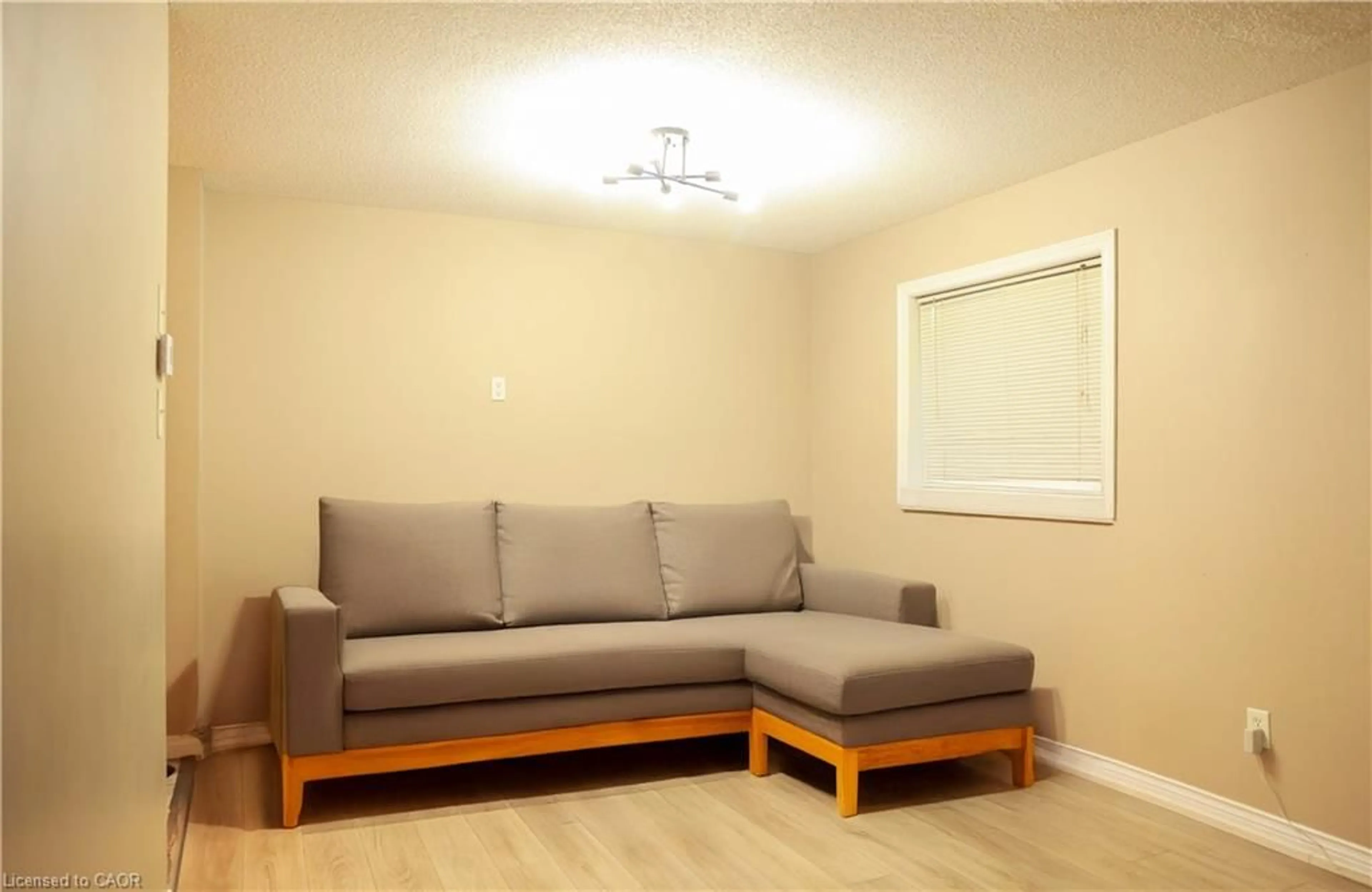 Living room with furniture, wood/laminate floor for 67 Stollar Blvd, Barrie Ontario L4N 6N3