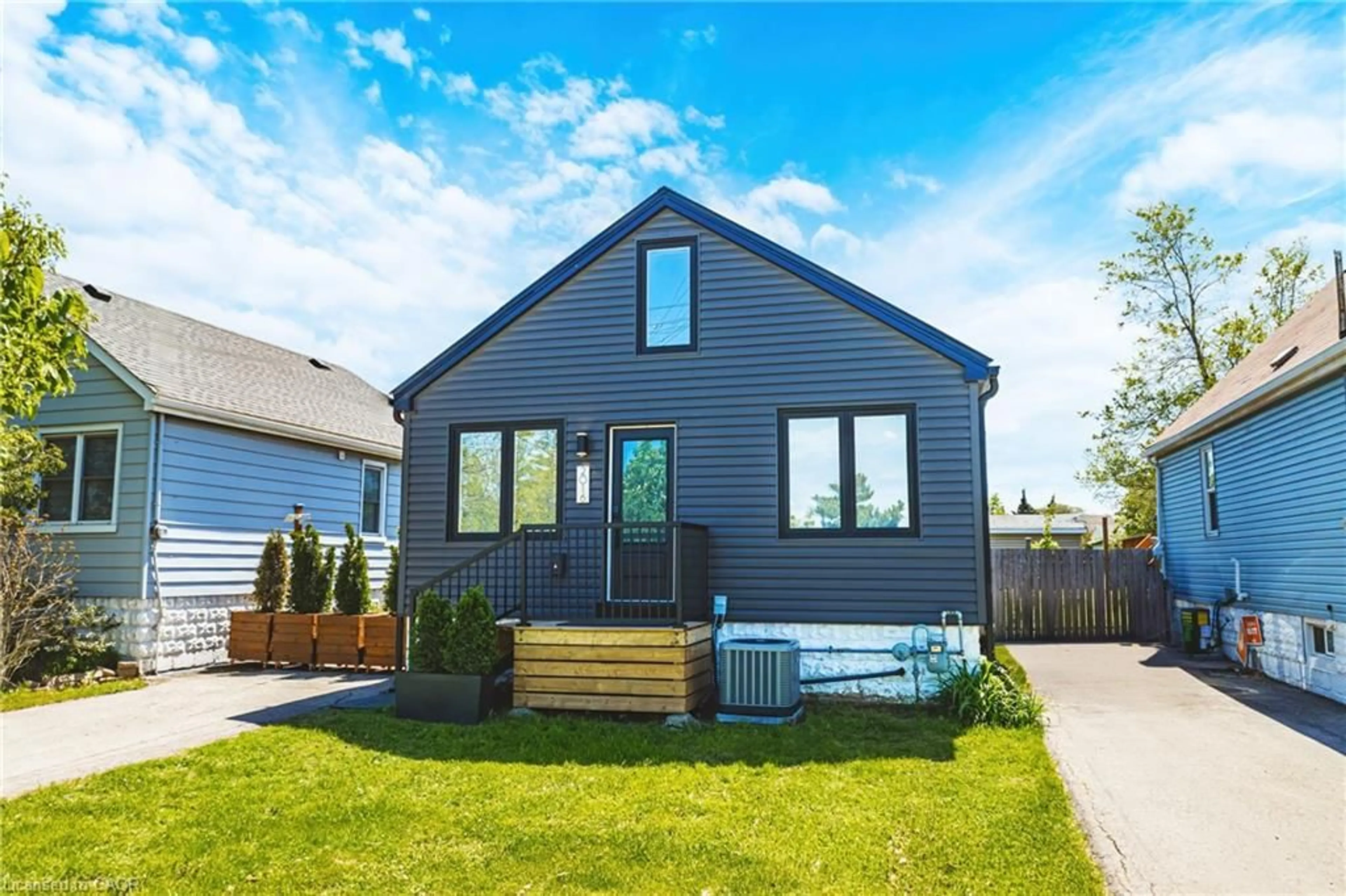 Home with vinyl exterior material, street for 2016 Barton St, Hamilton Ontario L8H 2Y8