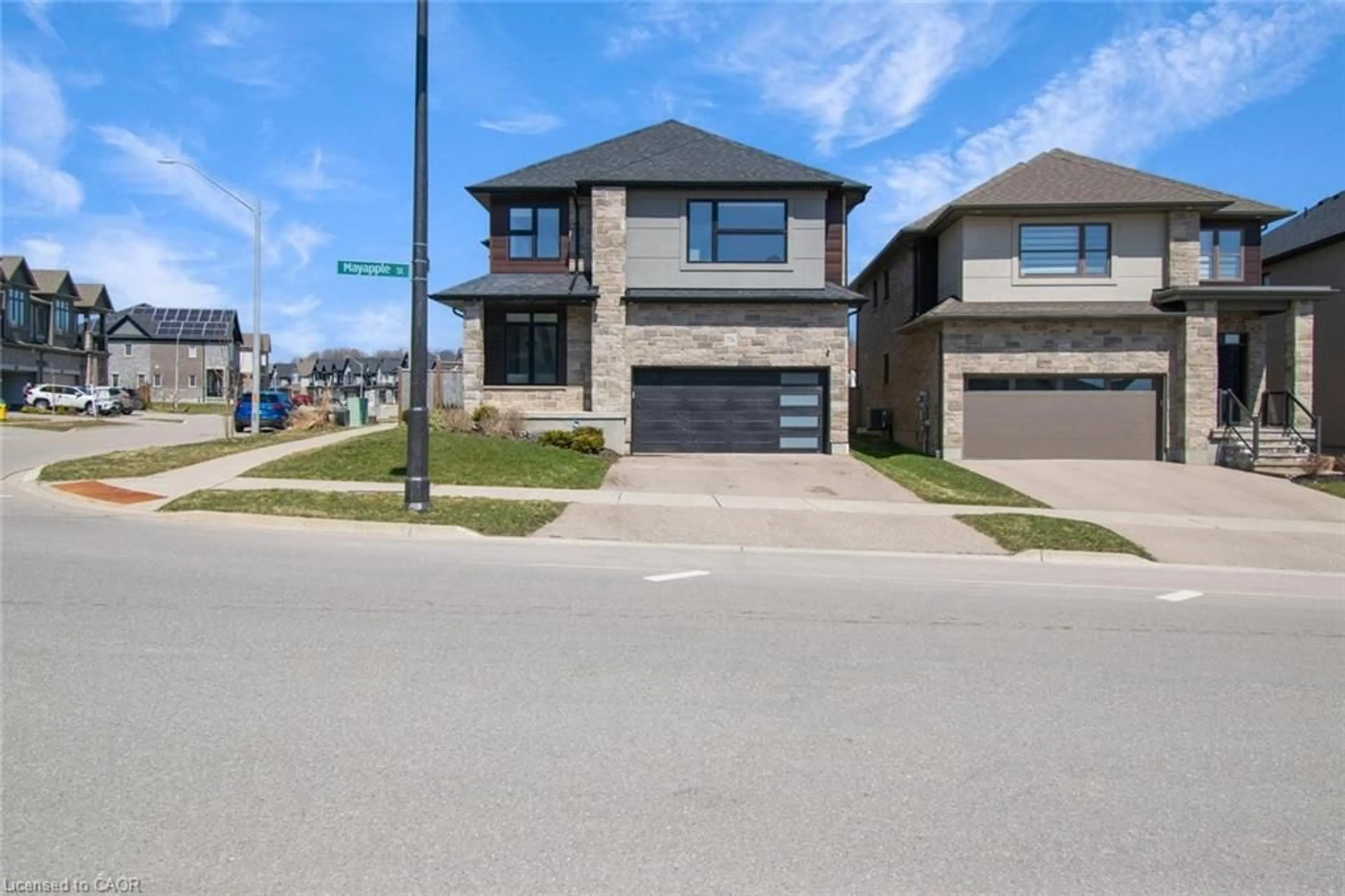 Home with brick exterior material, street for 556 Mayapple St, Waterloo Ontario N2V 0C3