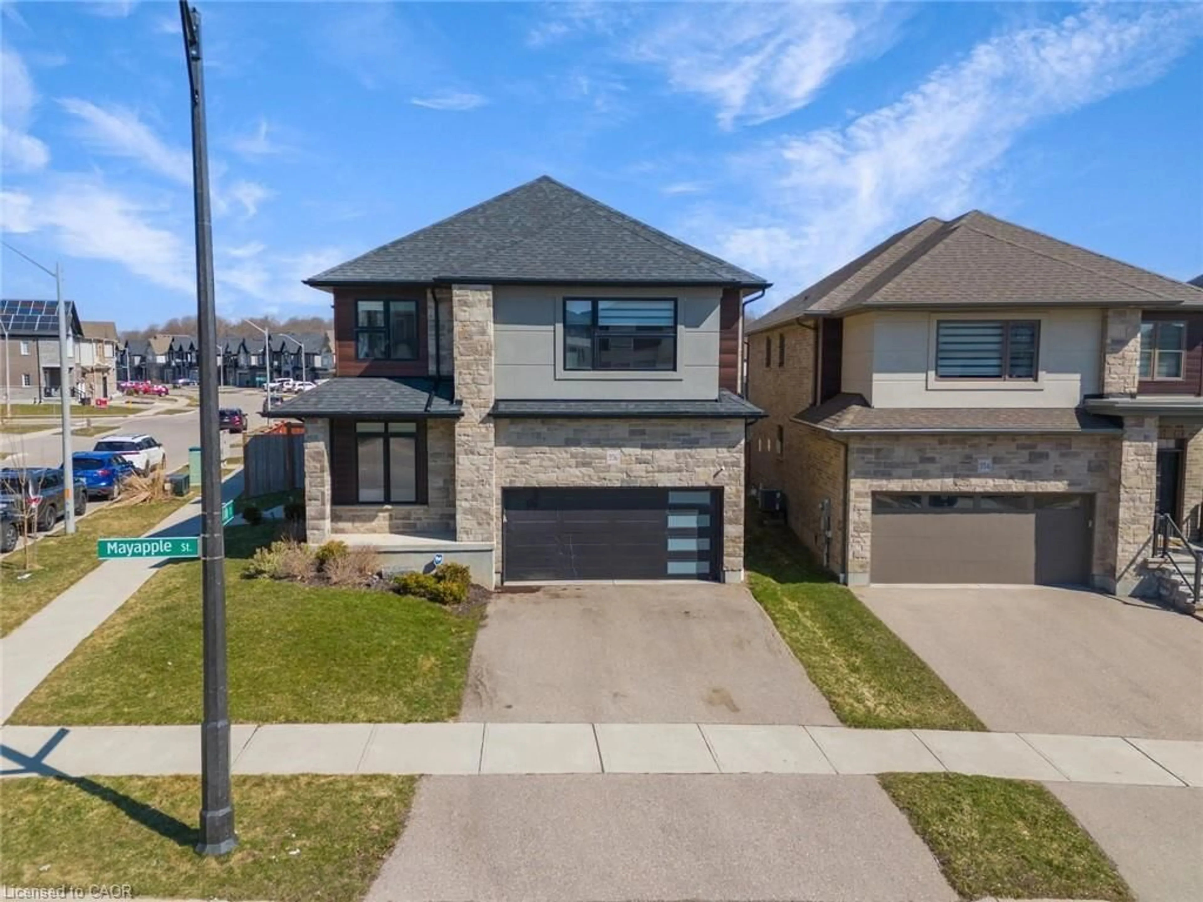 Home with brick exterior material, street for 556 Mayapple St, Waterloo Ontario N2V 0C3