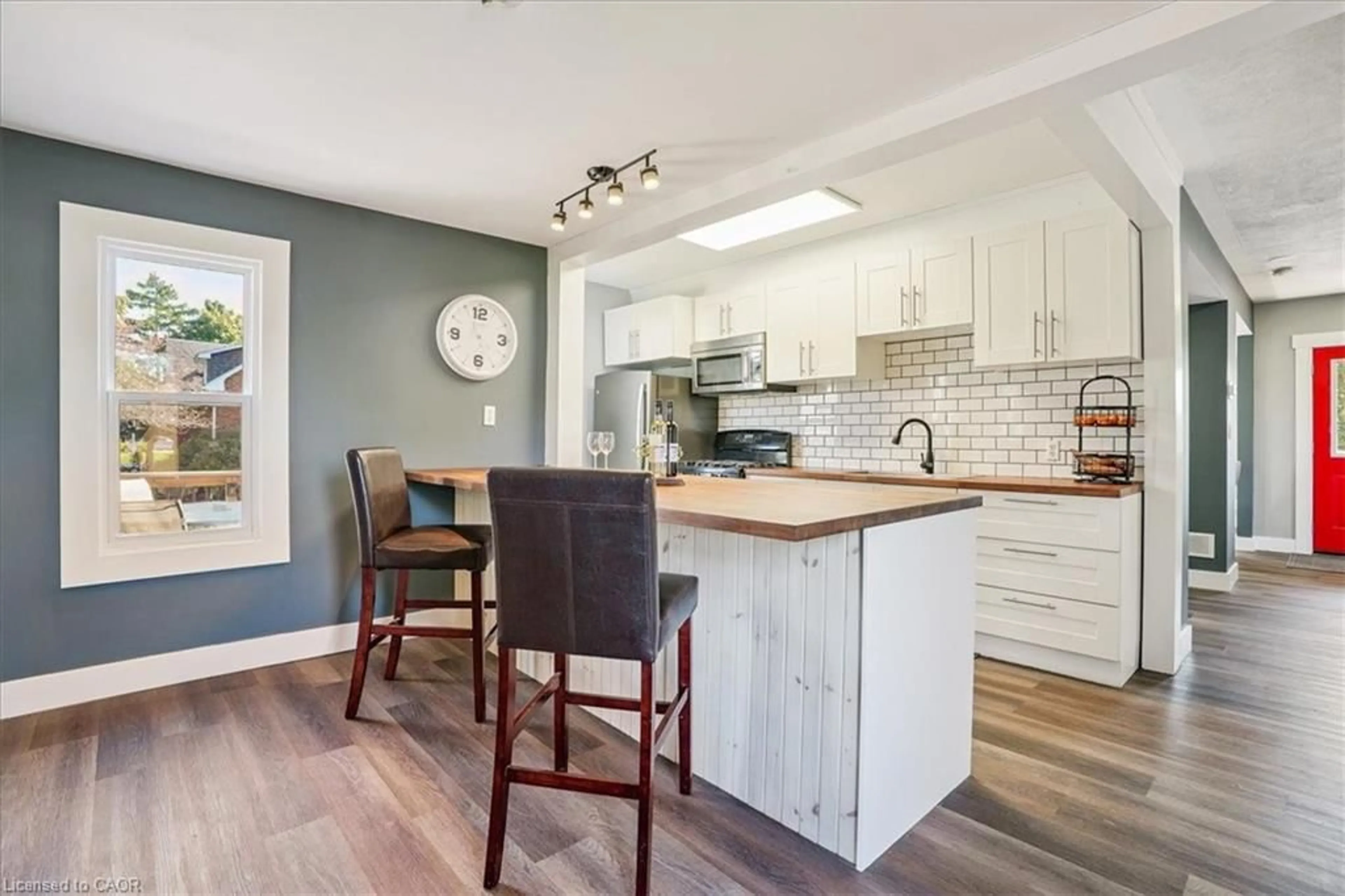 Open concept kitchen, wood/laminate floor for 15 Main Ave, Fisherville Ontario N0A 1G0
