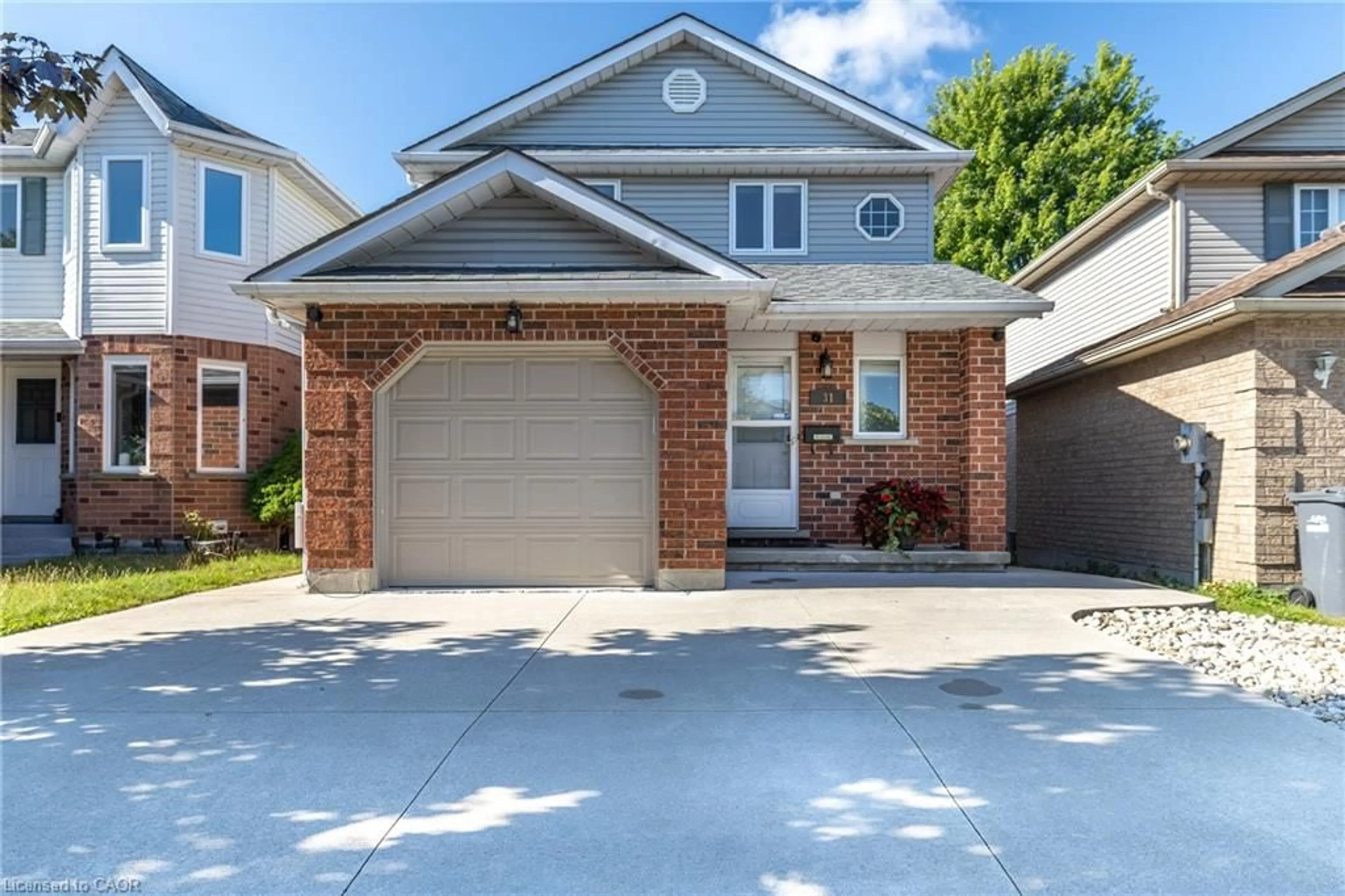 Home with brick exterior material, street for 31 Bushmills Cres, Guelph Ontario N1K 1T6